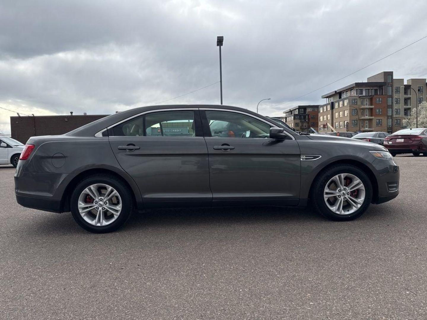 2016 GRAY Ford Taurus SEL (1FAHP2E85GG) with an V6, 3.5L engine, Automatic transmission, located at 10890 W. Colfax Ave., Lakewood, CO, 80215, (303) 274-7692, 39.739914, -105.120132 - Photo#3