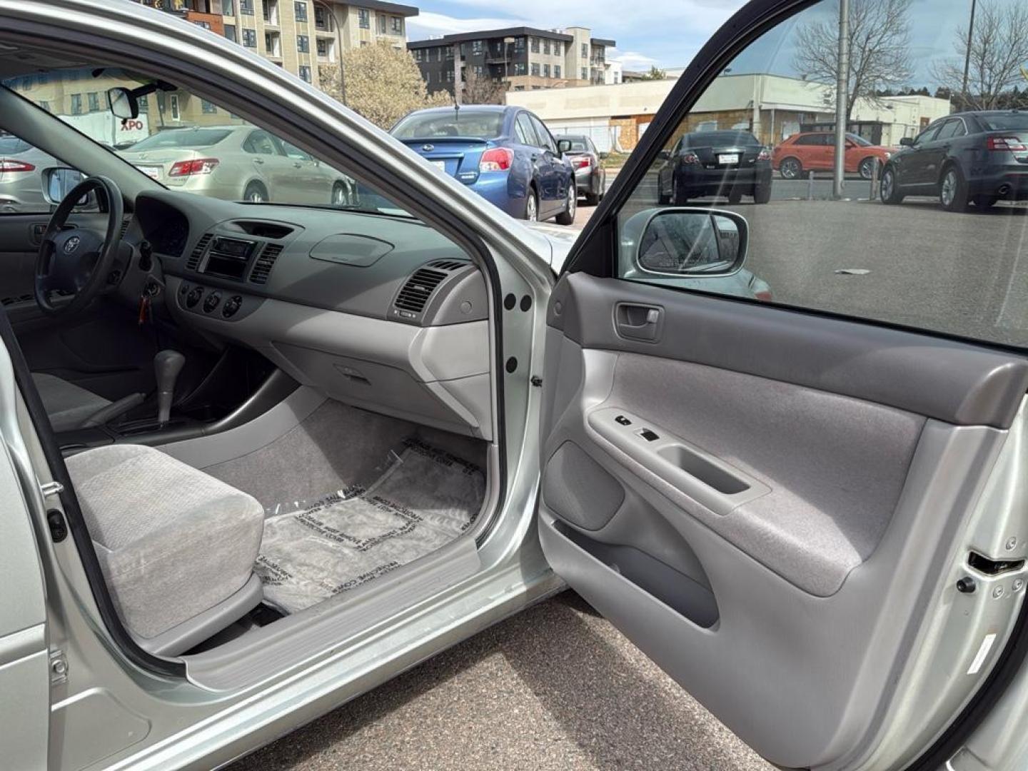 2002 SILVER Toyota Camry LE (JTDBE32K520) with an 4 Cyl, 2.4L engine, Automatic transmission, located at 10890 W. Colfax Ave., Lakewood, CO, 80215, (303) 274-7692, 39.739914, -105.120132 - Photo#19