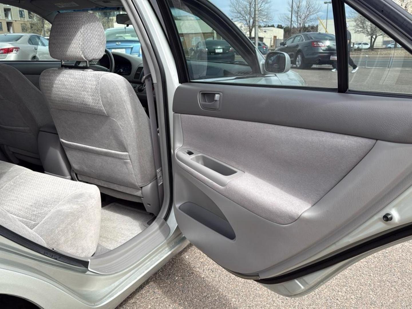 2002 SILVER Toyota Camry LE (JTDBE32K520) with an 4 Cyl, 2.4L engine, Automatic transmission, located at 10890 W. Colfax Ave., Lakewood, CO, 80215, (303) 274-7692, 39.739914, -105.120132 - Photo#20