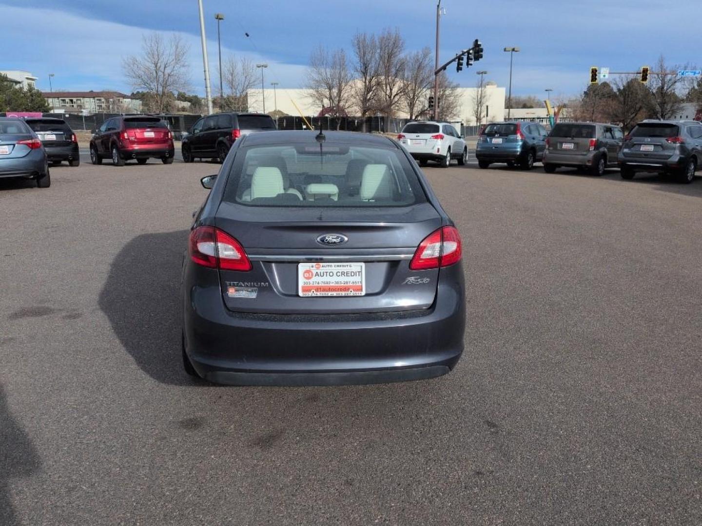 2013 BLUE Ford Fiesta Titanium (3FADP4CJ7DM) with an 4 Cyl, 1.6L engine, Manual transmission, located at 10890 W. Colfax Ave., Lakewood, CO, 80215, (303) 274-7692, 39.739914, -105.120132 - Photo#5