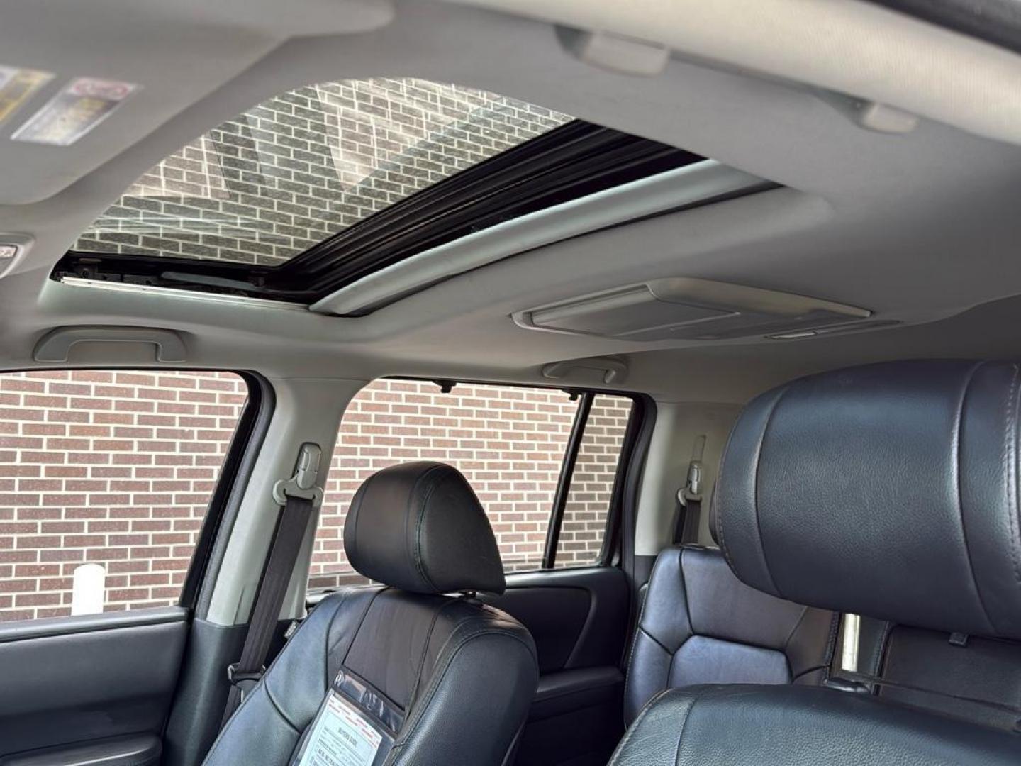 2014 BLACK Honda Pilot Touring-RES (5FNYF4H97EB) with an V6, 3.5L engine, Automatic transmission, located at 10890 W. Colfax Ave., Lakewood, CO, 80215, (303) 274-7692, 39.739914, -105.120132 - Photo#21