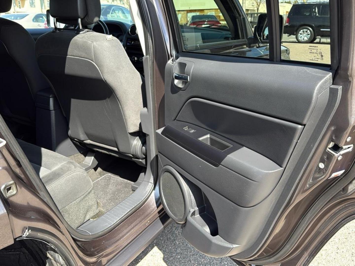 2015 GRAY Jeep Patriot Latitude (1C4NJRFB9FD) with an 4 Cyl, 2.4L engine, Manual transmission, located at 10890 W. Colfax Ave., Lakewood, CO, 80215, (303) 274-7692, 39.739914, -105.120132 - Photo#20
