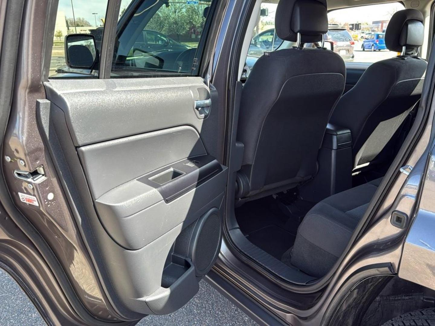 2015 GRAY Jeep Patriot Latitude (1C4NJRFB9FD) with an 4 Cyl, 2.4L engine, Manual transmission, located at 10890 W. Colfax Ave., Lakewood, CO, 80215, (303) 274-7692, 39.739914, -105.120132 - Photo#21