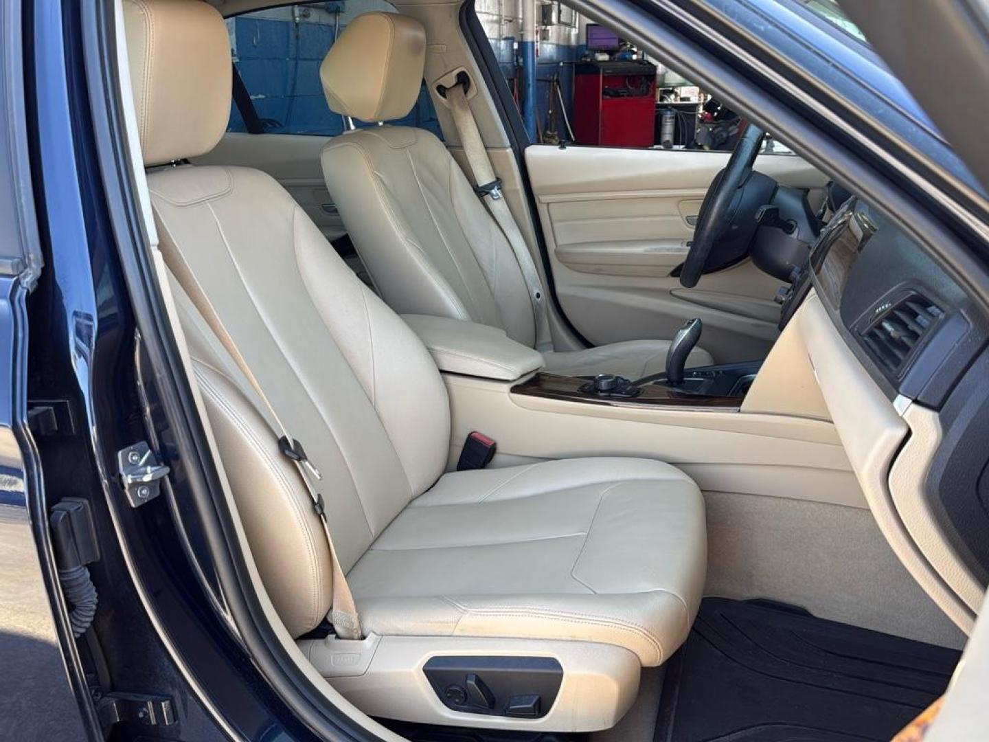 2014 BLUE /TAN BMW 3 series 320i XDrive (WBA3C3C59EK) with an 4 Cyl, 2.0L engine, Automatic transmission, located at 10890 W. Colfax Ave., Lakewood, CO, 80215, (303) 274-7692, 39.739914, -105.120132 - <b>Summary</b><br>Check out this low mile, All Wheel Drive BMW 3 Series. Loaded with heated leather seats, Sun Roof, Bluetoothe Audio and much more. One Owner, Clean Colorado tile with no accidents. This one has been very well maintained and tons of records on the FREE Carfax. Heated Leather Seats, - Photo#15