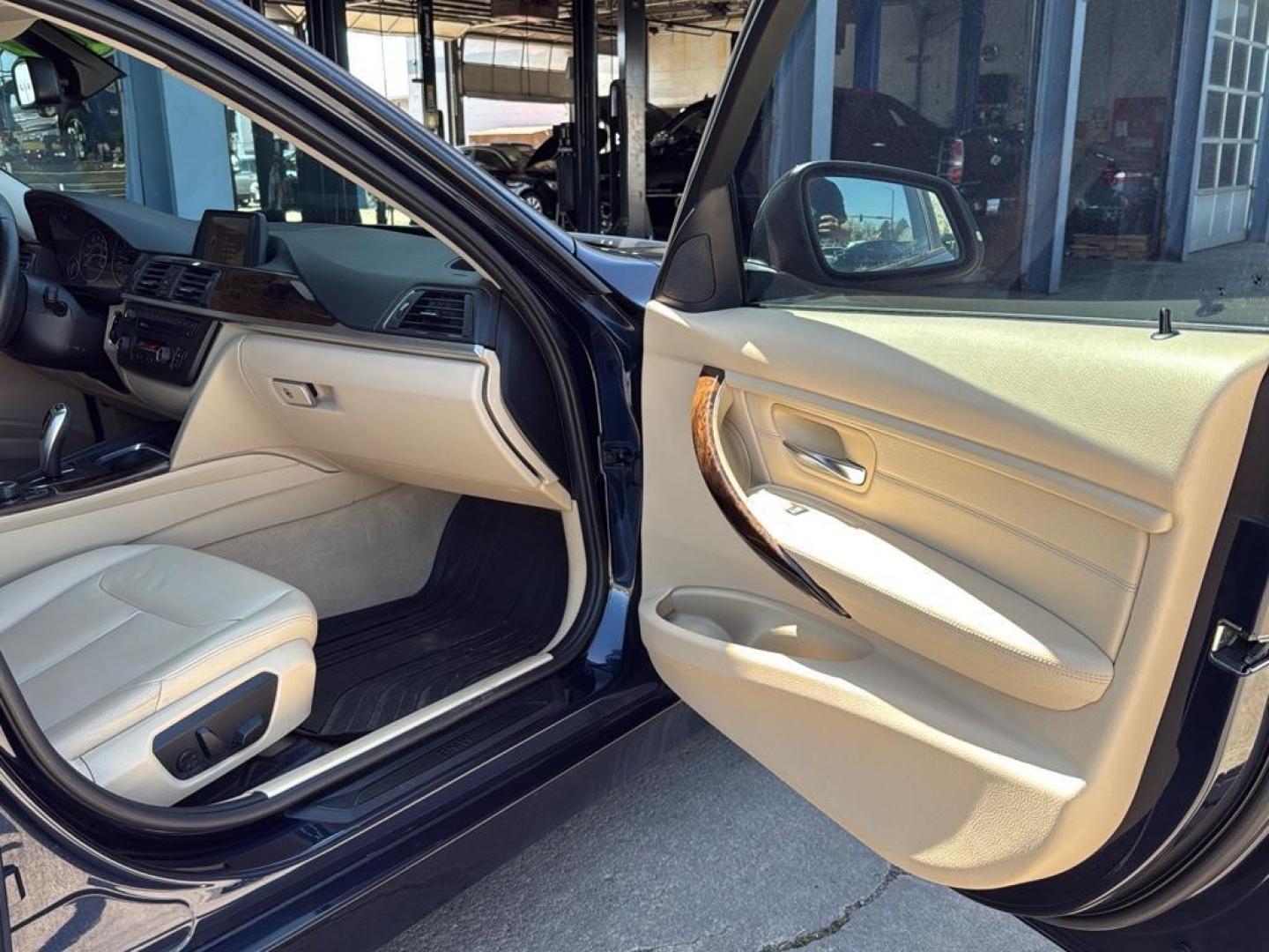 2014 BLUE /TAN BMW 3 series 320i XDrive (WBA3C3C59EK) with an 4 Cyl, 2.0L engine, Automatic transmission, located at 10890 W. Colfax Ave., Lakewood, CO, 80215, (303) 274-7692, 39.739914, -105.120132 - <b>Summary</b><br>Check out this low mile, All Wheel Drive BMW 3 Series. Loaded with heated leather seats, Sun Roof, Bluetoothe Audio and much more. One Owner, Clean Colorado tile with no accidents. This one has been very well maintained and tons of records on the FREE Carfax. Heated Leather Seats, - Photo#25