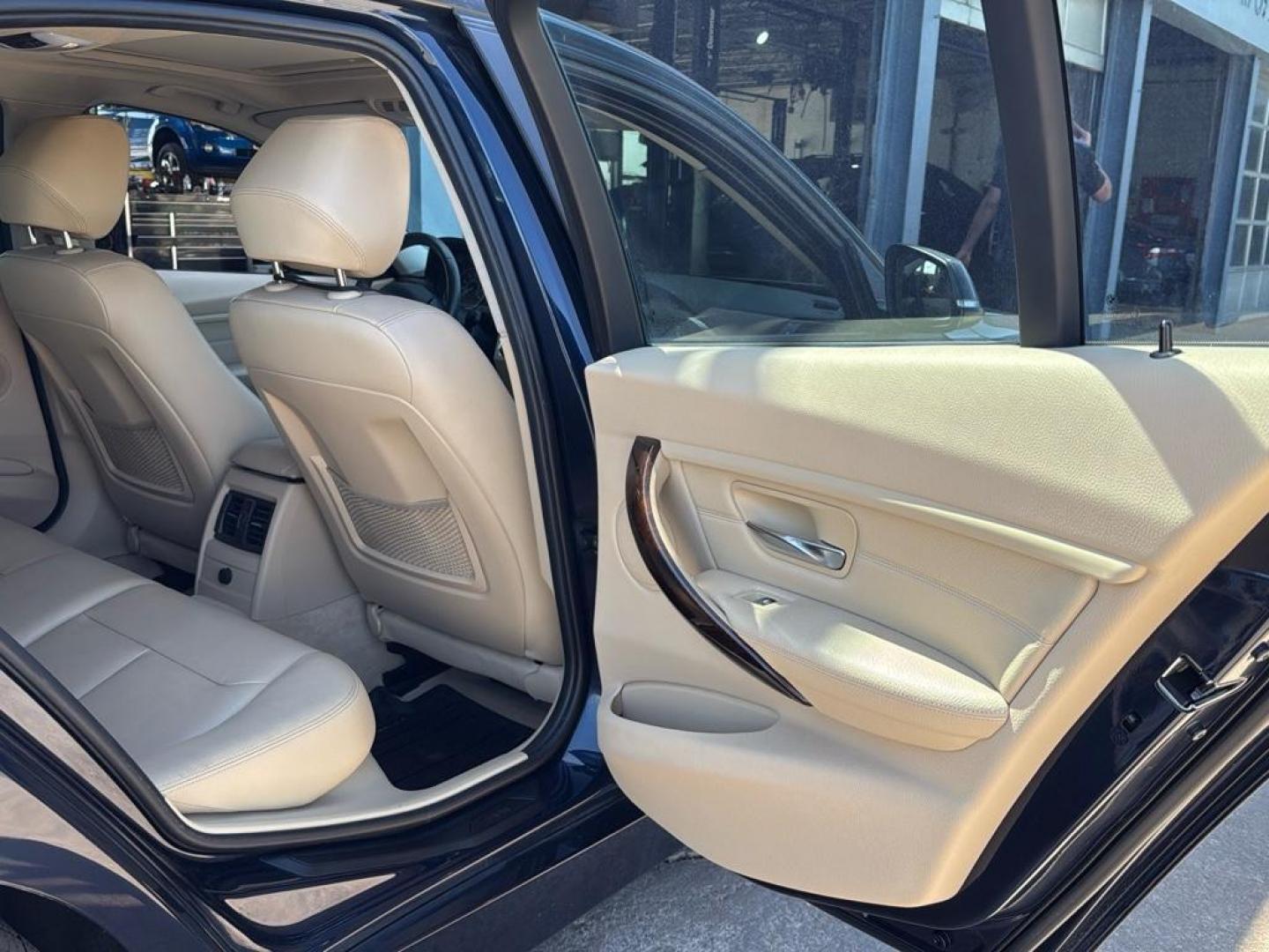 2014 BLUE /TAN BMW 3 series 320i XDrive (WBA3C3C59EK) with an 4 Cyl, 2.0L engine, Automatic transmission, located at 10890 W. Colfax Ave., Lakewood, CO, 80215, (303) 274-7692, 39.739914, -105.120132 - <b>Summary</b><br>Check out this low mile, All Wheel Drive BMW 3 Series. Loaded with heated leather seats, Sun Roof, Bluetoothe Audio and much more. One Owner, Clean Colorado tile with no accidents. This one has been very well maintained and tons of records on the FREE Carfax. Heated Leather Seats, - Photo#26