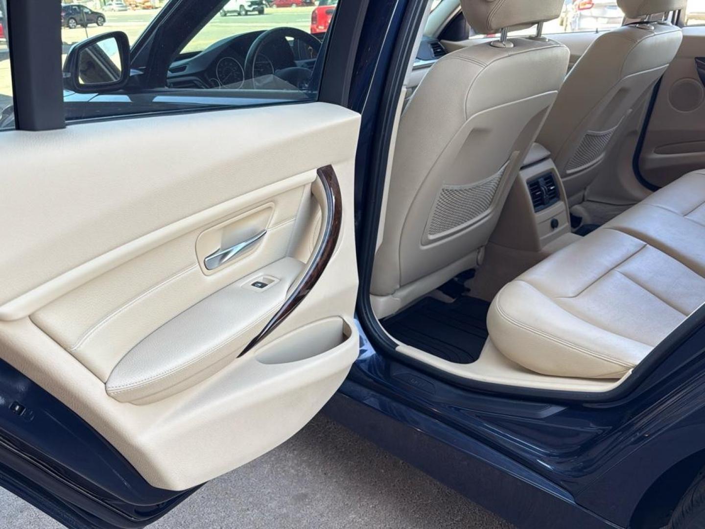 2014 BLUE /TAN BMW 3 series 320i XDrive (WBA3C3C59EK) with an 4 Cyl, 2.0L engine, Automatic transmission, located at 10890 W. Colfax Ave., Lakewood, CO, 80215, (303) 274-7692, 39.739914, -105.120132 - <b>Summary</b><br>Check out this low mile, All Wheel Drive BMW 3 Series. Loaded with heated leather seats, Sun Roof, Bluetoothe Audio and much more. One Owner, Clean Colorado tile with no accidents. This one has been very well maintained and tons of records on the FREE Carfax. Heated Leather Seats, - Photo#27