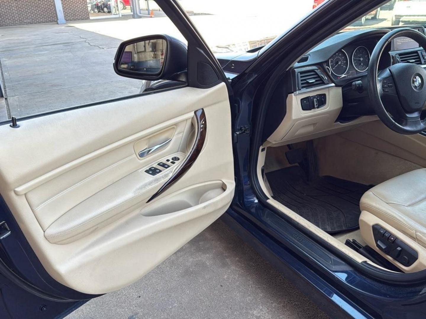 2014 BLUE /TAN BMW 3 series 320i XDrive (WBA3C3C59EK) with an 4 Cyl, 2.0L engine, Automatic transmission, located at 10890 W. Colfax Ave., Lakewood, CO, 80215, (303) 274-7692, 39.739914, -105.120132 - <b>Summary</b><br>Check out this low mile, All Wheel Drive BMW 3 Series. Loaded with heated leather seats, Sun Roof, Bluetoothe Audio and much more. One Owner, Clean Colorado tile with no accidents. This one has been very well maintained and tons of records on the FREE Carfax. Heated Leather Seats, - Photo#28