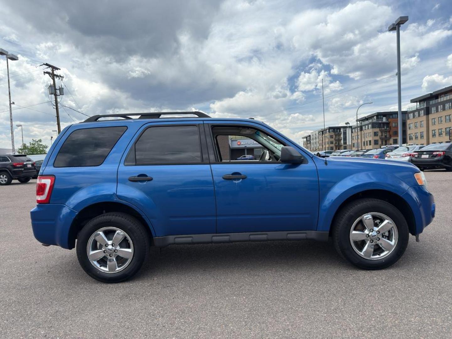 2011 BLUE Ford Escape XLT (1FMCU9DG8BK) with an V6, 3.0L engine, Automatic transmission, located at 10890 W. Colfax Ave., Lakewood, CO, 80215, (303) 274-7692, 39.739914, -105.120132 - Discover the reliability and versatility of the 2011 Ford Escape XLT, a compact SUV designed to meet diverse driving needs. This model features a robust 4WD system, perfect for tackling various road conditions with ease and confidence. Under the hood, you'll find a powerful V6, 3.0L engine that deli - Photo#3