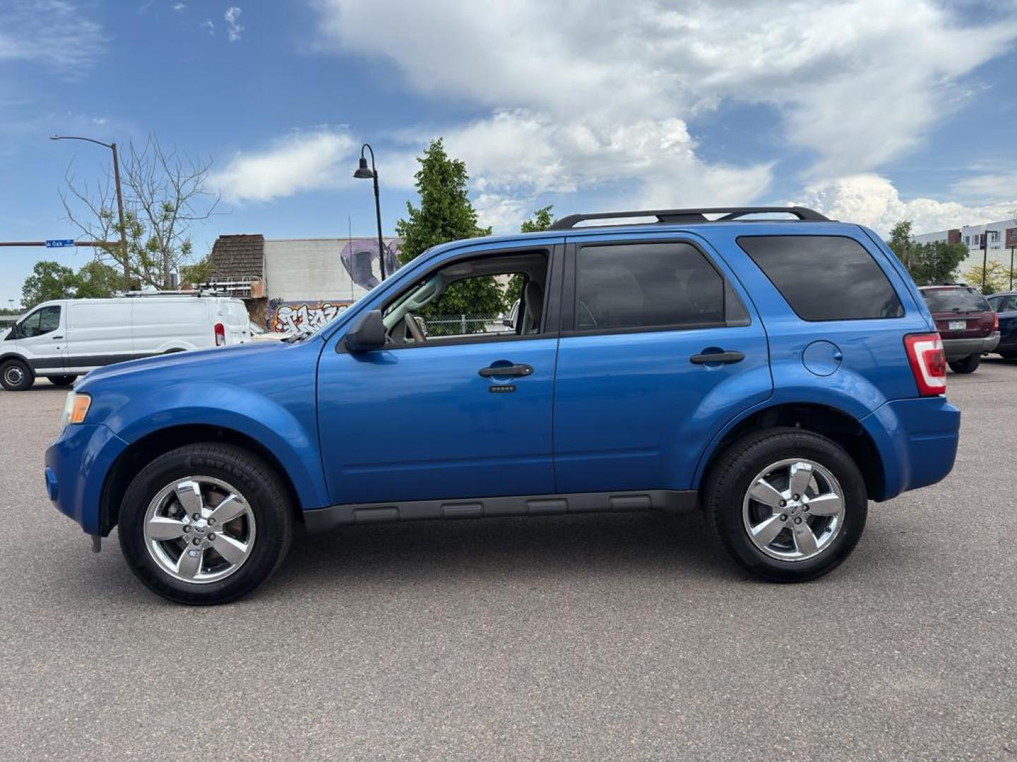 2011 BLUE Ford Escape XLT (1FMCU9DG8BK) with an V6, 3.0L engine, Automatic transmission, located at 10890 W. Colfax Ave., Lakewood, CO, 80215, (303) 274-7692, 39.739914, -105.120132 - Discover the reliability and versatility of the 2011 Ford Escape XLT, a compact SUV designed to meet diverse driving needs. This model features a robust 4WD system, perfect for tackling various road conditions with ease and confidence. Under the hood, you'll find a powerful V6, 3.0L engine that deli - Photo#7