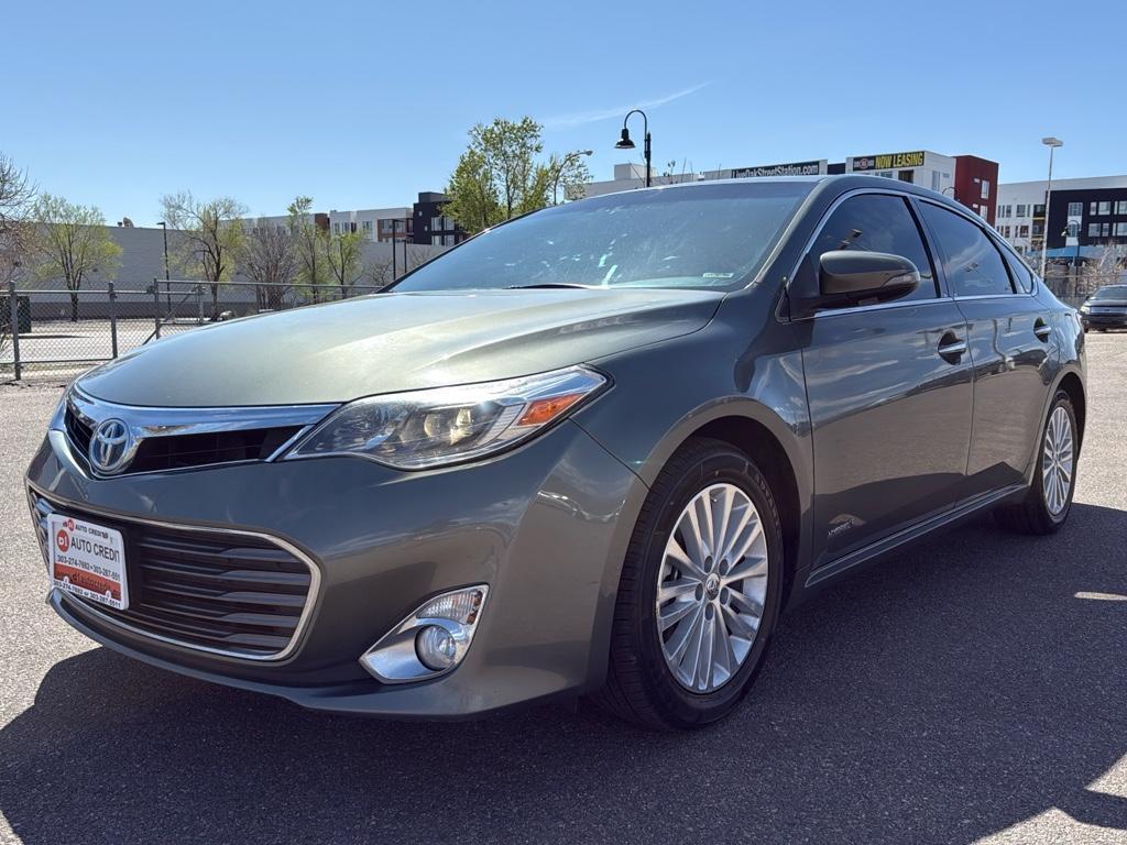2013 GREEN Toyota Avalon Hybrid XLE TOURING (4T1BD1EB4DU) with an 4 Cyl, 2.5L engine, Automatic transmission, located at 10890 W. Colfax Ave., Lakewood, CO, 80215, (303) 274-7692, 39.739914, -105.120132 - For sale: a meticulously maintained 2013 Toyota Avalon Hybrid XLE Touring that combines luxury, efficiency, and reliability. This sophisticated sedan features a robust 4-cylinder, 2.5L engine paired with front-wheel drive, offering an impressive blend of power and fuel economy. The Avalons hybrid te - Photo#0