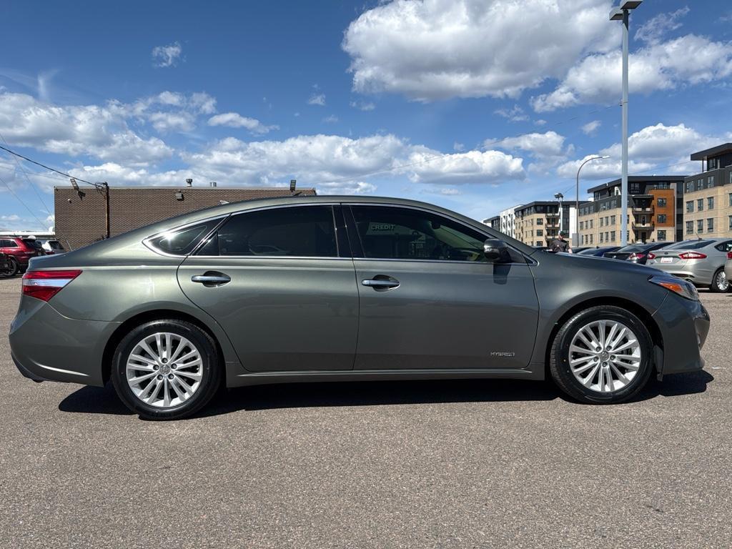 2013 GREEN Toyota Avalon Hybrid XLE TOURING (4T1BD1EB4DU) with an 4 Cyl, 2.5L engine, Automatic transmission, located at 10890 W. Colfax Ave., Lakewood, CO, 80215, (303) 274-7692, 39.739914, -105.120132 - For sale: a meticulously maintained 2013 Toyota Avalon Hybrid XLE Touring that combines luxury, efficiency, and reliability. This sophisticated sedan features a robust 4-cylinder, 2.5L engine paired with front-wheel drive, offering an impressive blend of power and fuel economy. The Avalons hybrid te - Photo#3
