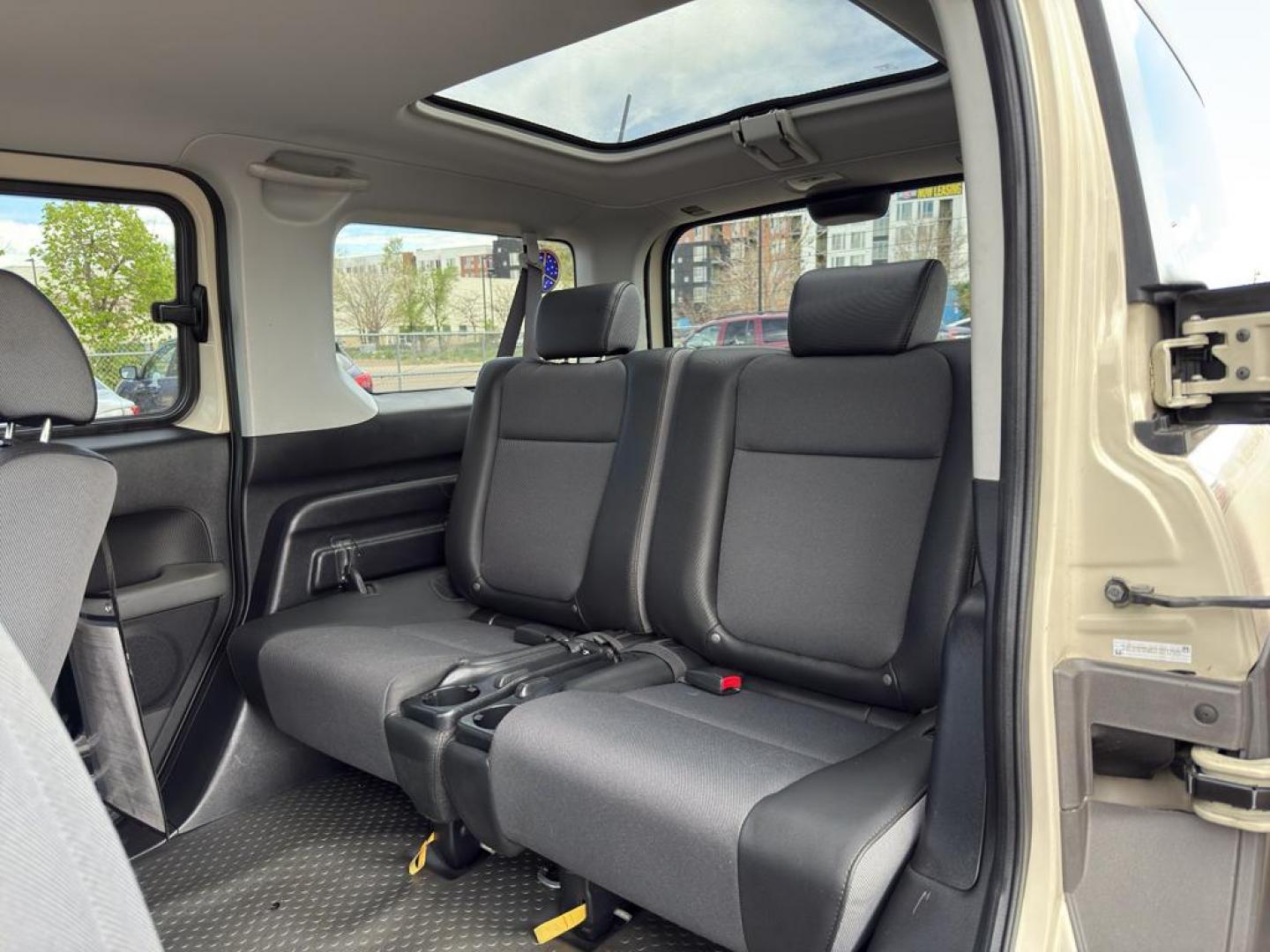 2005 TAN Honda Element EX (5J6YH28685L) with an 4 Cyl, 2.4L engine, Automatic transmission, located at 10890 W. Colfax Ave., Lakewood, CO, 80215, (303) 274-7692, 39.739914, -105.120132 - Discover the perfect blend of versatility and reliability with this 2005 Honda Element EX! A true gem for adventurers and city dwellers alike, this unique SUV stands out with its iconic boxy design and spacious interior. Powered by a robust 4-cylinder, 2.4L engine, this Honda Element delivers a smoo - Photo#14