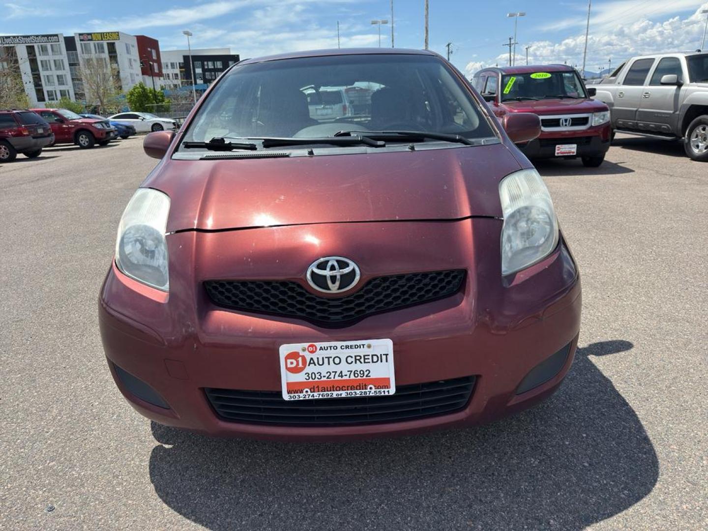 2009 RED Toyota Yaris LIFTBACK 3-DOOR AT (JTDJT903X95) with an 4 Cyl, 1.5L engine, Automatic transmission, located at 10890 W. Colfax Ave., Lakewood, CO, 80215, (303) 274-7692, 39.739914, -105.120132 - Photo#1