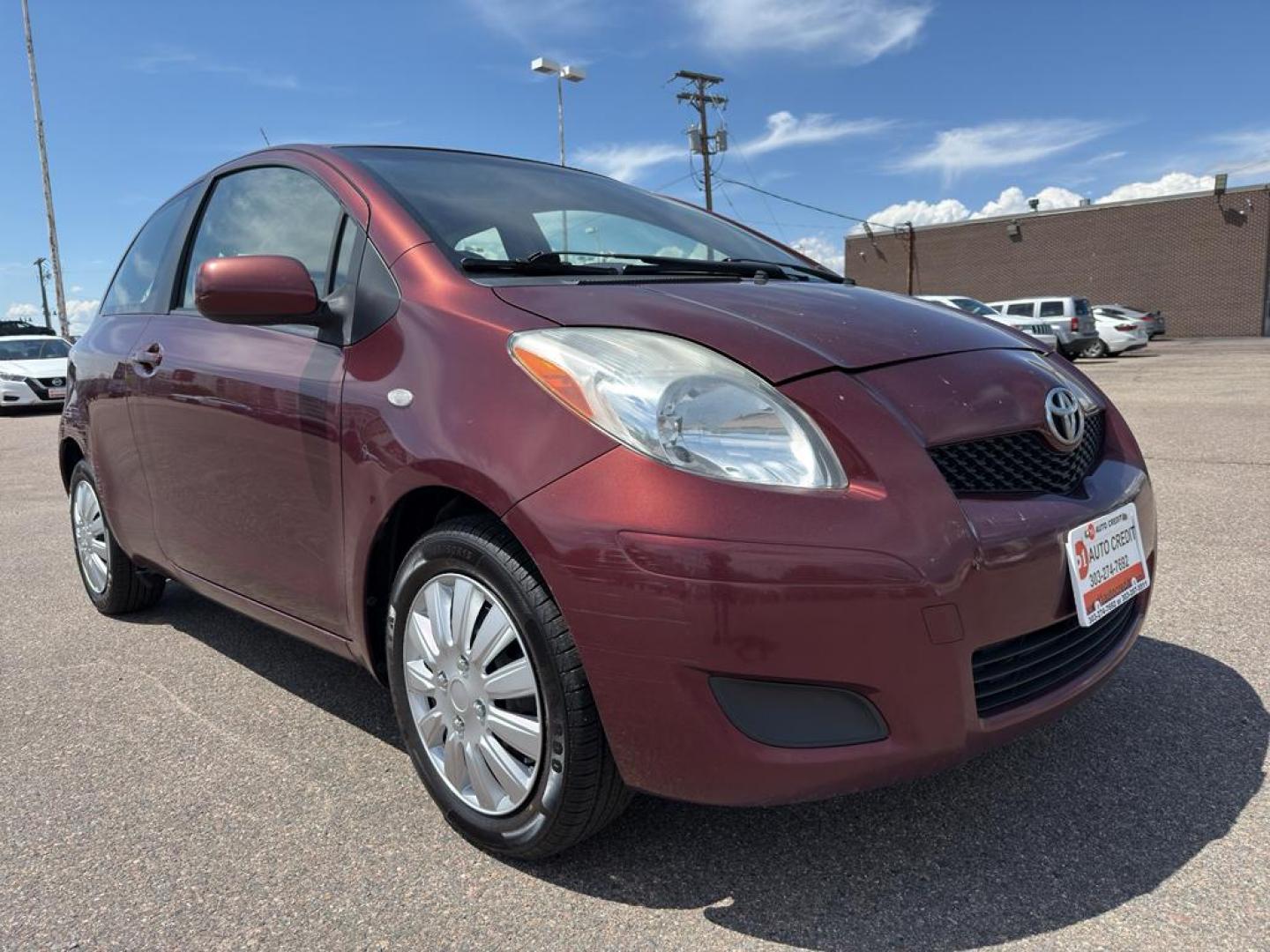 2009 RED Toyota Yaris LIFTBACK 3-DOOR AT (JTDJT903X95) with an 4 Cyl, 1.5L engine, Automatic transmission, located at 10890 W. Colfax Ave., Lakewood, CO, 80215, (303) 274-7692, 39.739914, -105.120132 - Photo#2