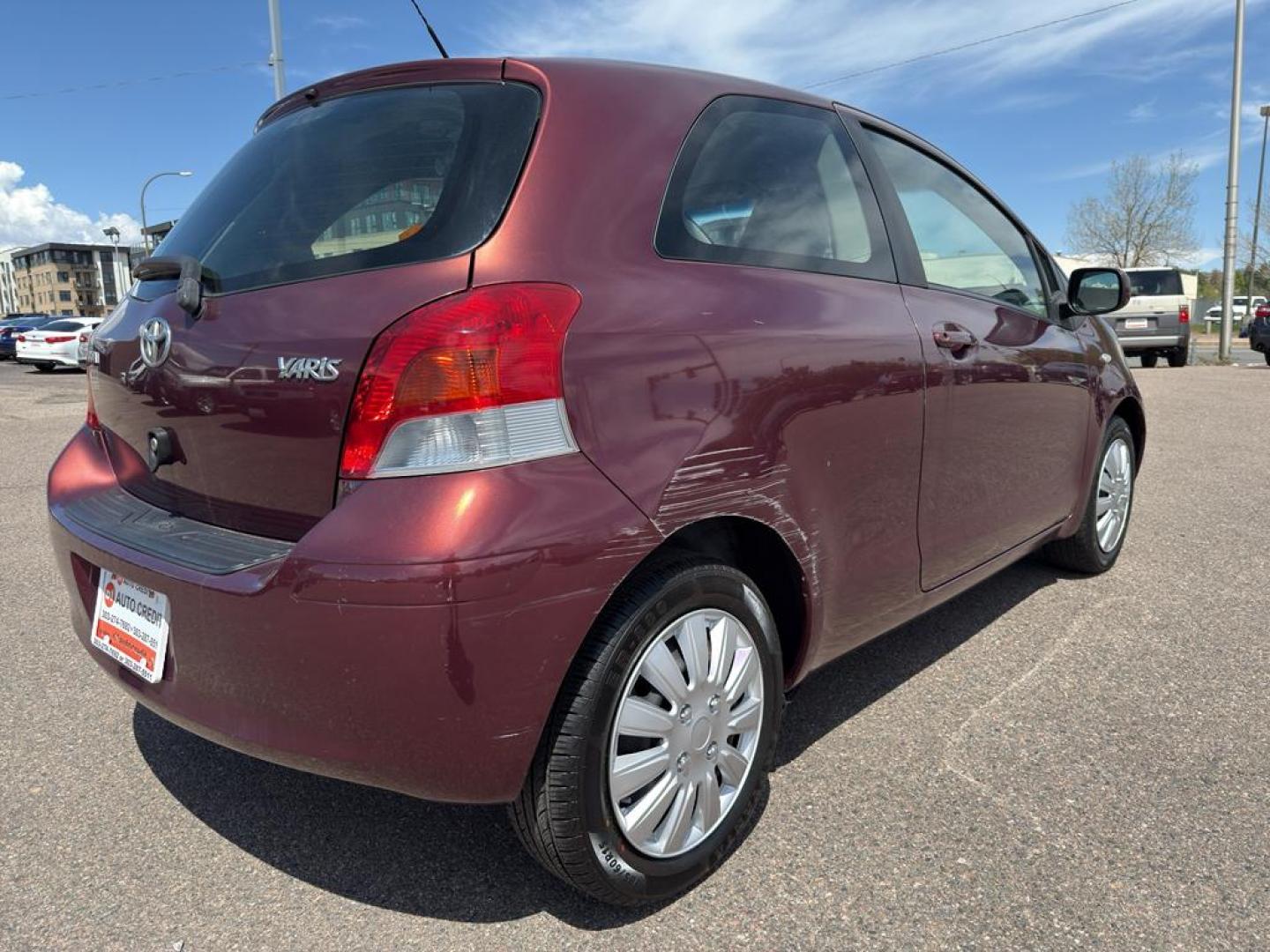 2009 RED Toyota Yaris LIFTBACK 3-DOOR AT (JTDJT903X95) with an 4 Cyl, 1.5L engine, Automatic transmission, located at 10890 W. Colfax Ave., Lakewood, CO, 80215, (303) 274-7692, 39.739914, -105.120132 - Photo#4