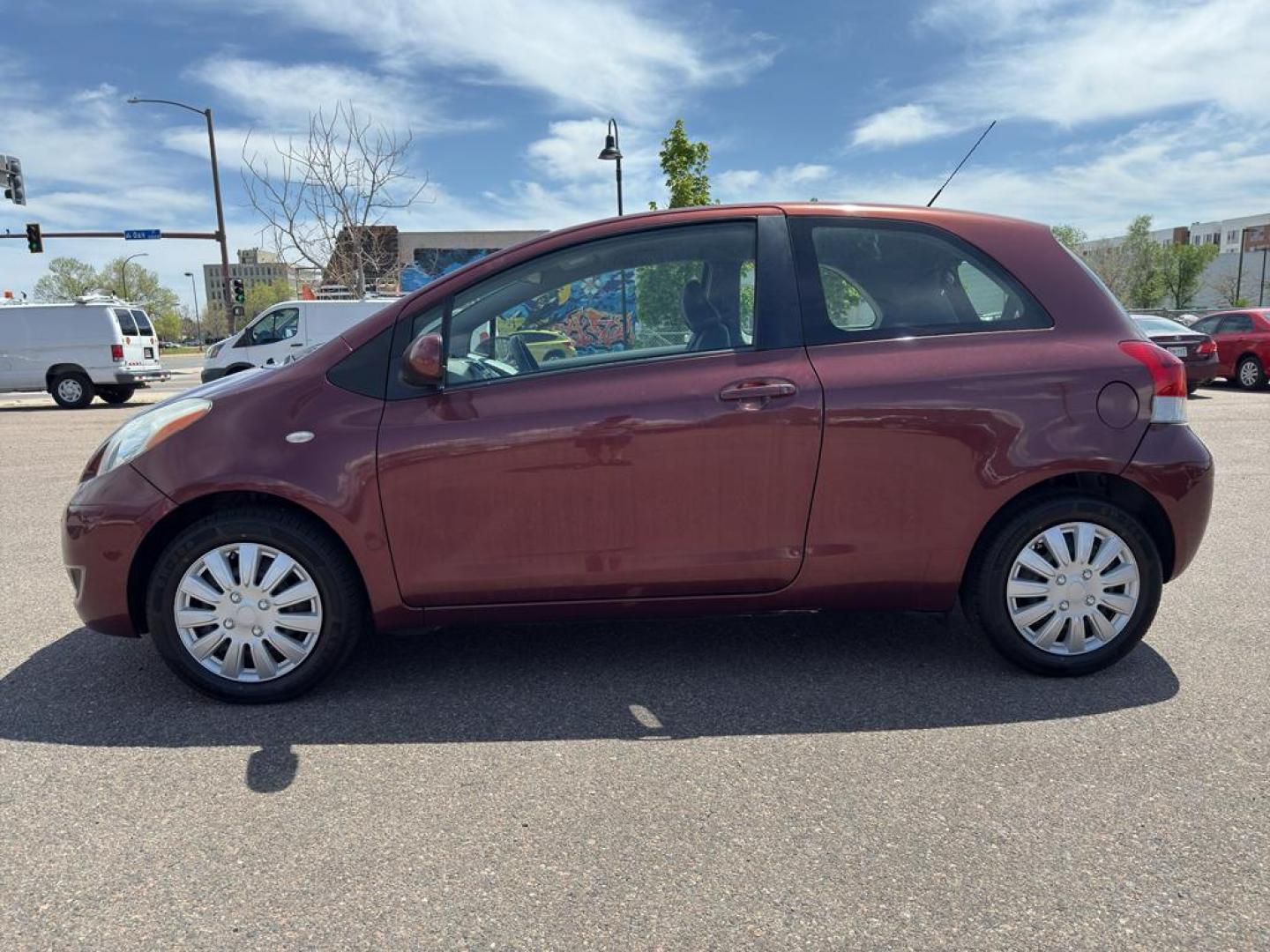 2009 RED Toyota Yaris LIFTBACK 3-DOOR AT (JTDJT903X95) with an 4 Cyl, 1.5L engine, Automatic transmission, located at 10890 W. Colfax Ave., Lakewood, CO, 80215, (303) 274-7692, 39.739914, -105.120132 - Photo#7