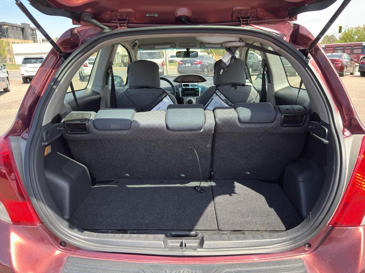 2009 RED Toyota Yaris LIFTBACK 3-DOOR AT (JTDJT903X95) with an 4 Cyl, 1.5L engine, Automatic transmission, located at 10890 W. Colfax Ave., Lakewood, CO, 80215, (303) 274-7692, 39.739914, -105.120132 - Photo#11