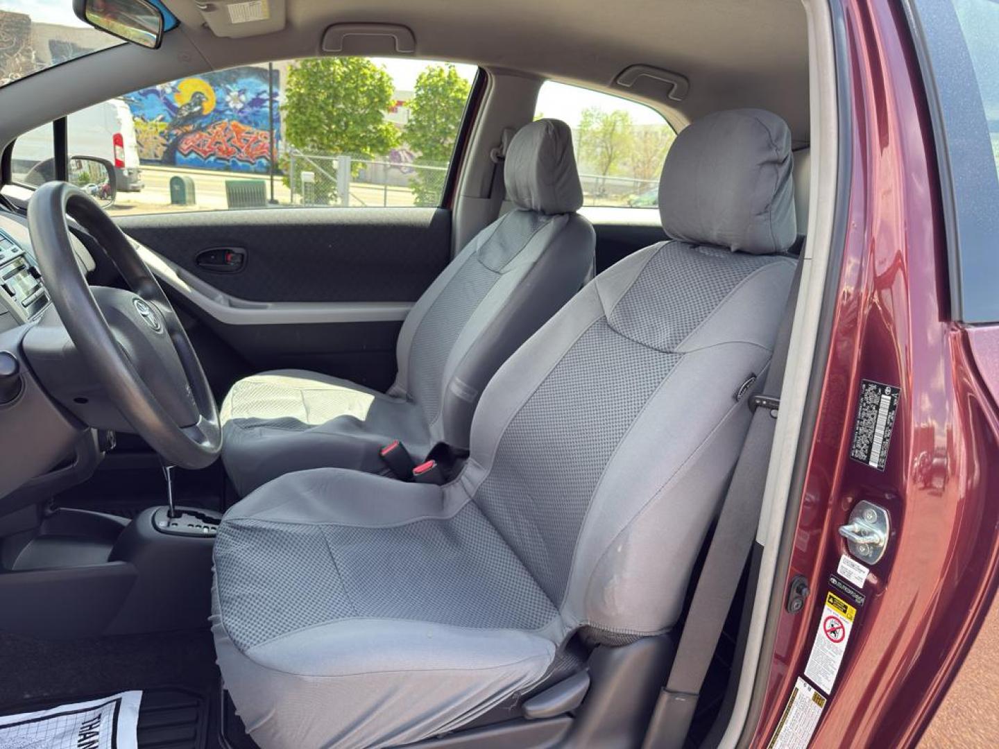 2009 RED Toyota Yaris LIFTBACK 3-DOOR AT (JTDJT903X95) with an 4 Cyl, 1.5L engine, Automatic transmission, located at 10890 W. Colfax Ave., Lakewood, CO, 80215, (303) 274-7692, 39.739914, -105.120132 - Photo#13