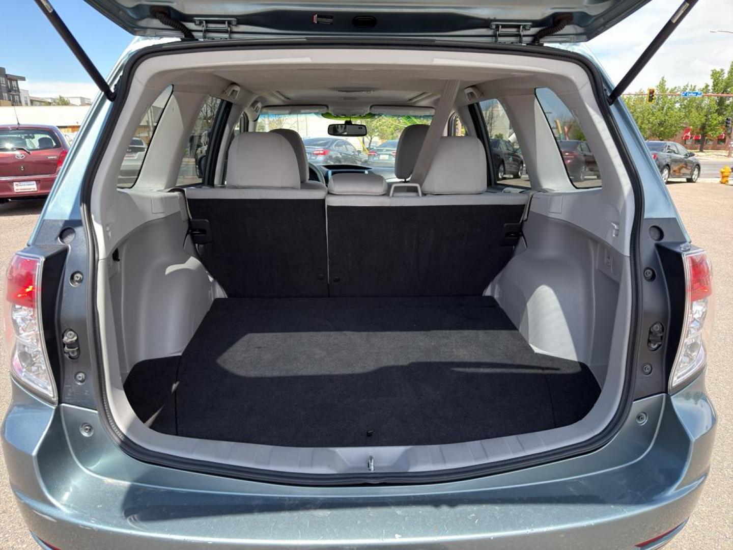 2012 GREEN Subaru Forester 2.5X Premium AWP (JF2SHADC5CH) with an 4 Cyl, 2.5L engine, Automatic transmission, located at 10890 W. Colfax Ave., Lakewood, CO, 80215, (303) 274-7692, 39.739914, -105.120132 - Discover the perfect blend of performance, comfort, and practicality with this 2012 Subaru Forester 2.5X Premium AWP! This versatile SUV is ready to accompany you on all of life's adventures, boasting Subaru's legendary All-Wheel Drive system that ensures confidence and stability, no matter the road - Photo#12