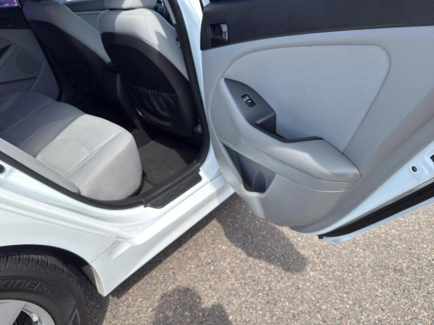 2015 WHITE Kia Optima LX (5XXGM4A71FG) with an 4 Cyl, 2.4L engine, Automatic transmission, located at 10890 W. Colfax Ave., Lakewood, CO, 80215, (303) 274-7692, 39.739914, -105.120132 - Photo#10