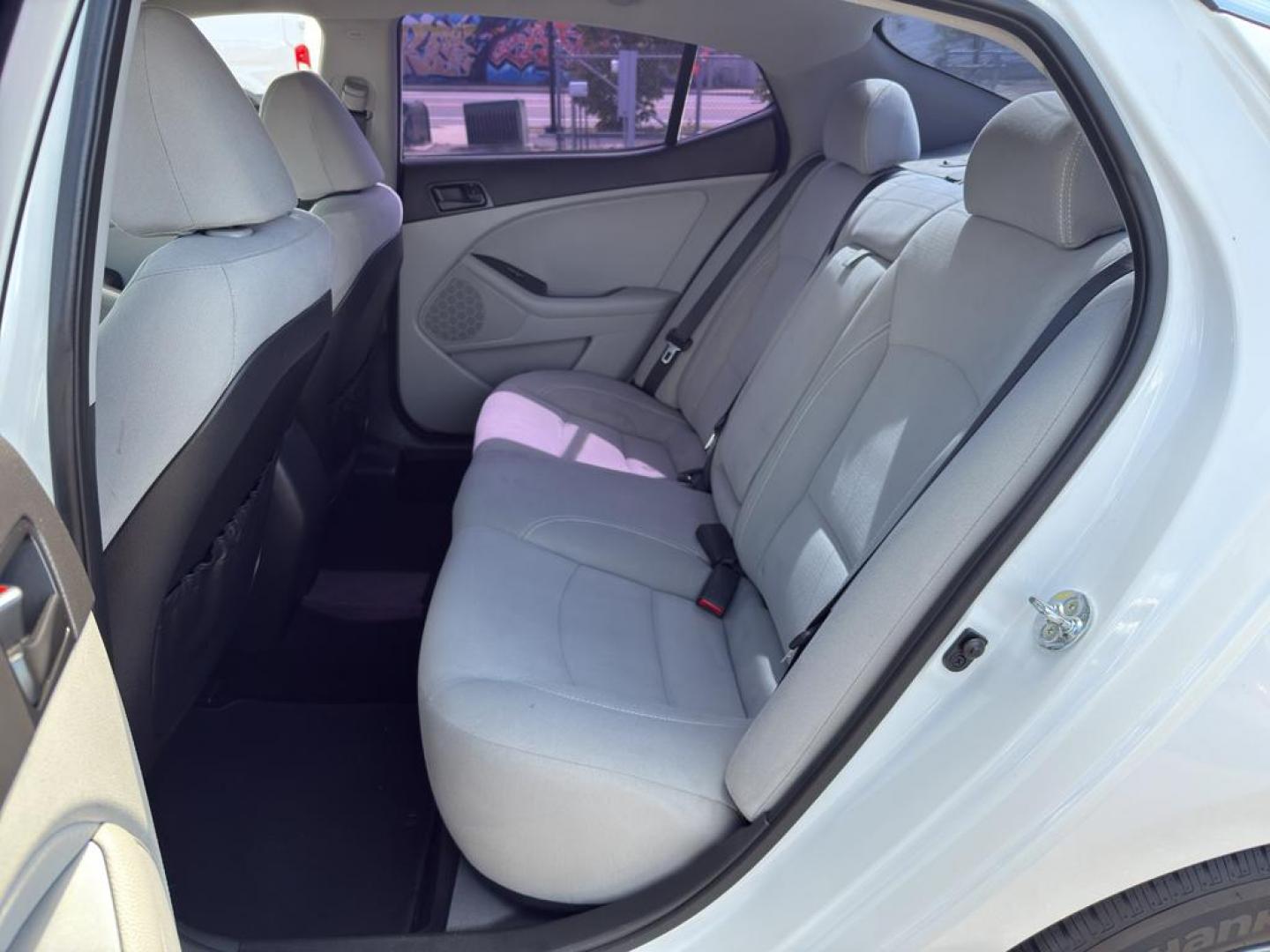 2015 WHITE Kia Optima LX (5XXGM4A71FG) with an 4 Cyl, 2.4L engine, Automatic transmission, located at 10890 W. Colfax Ave., Lakewood, CO, 80215, (303) 274-7692, 39.739914, -105.120132 - Photo#14