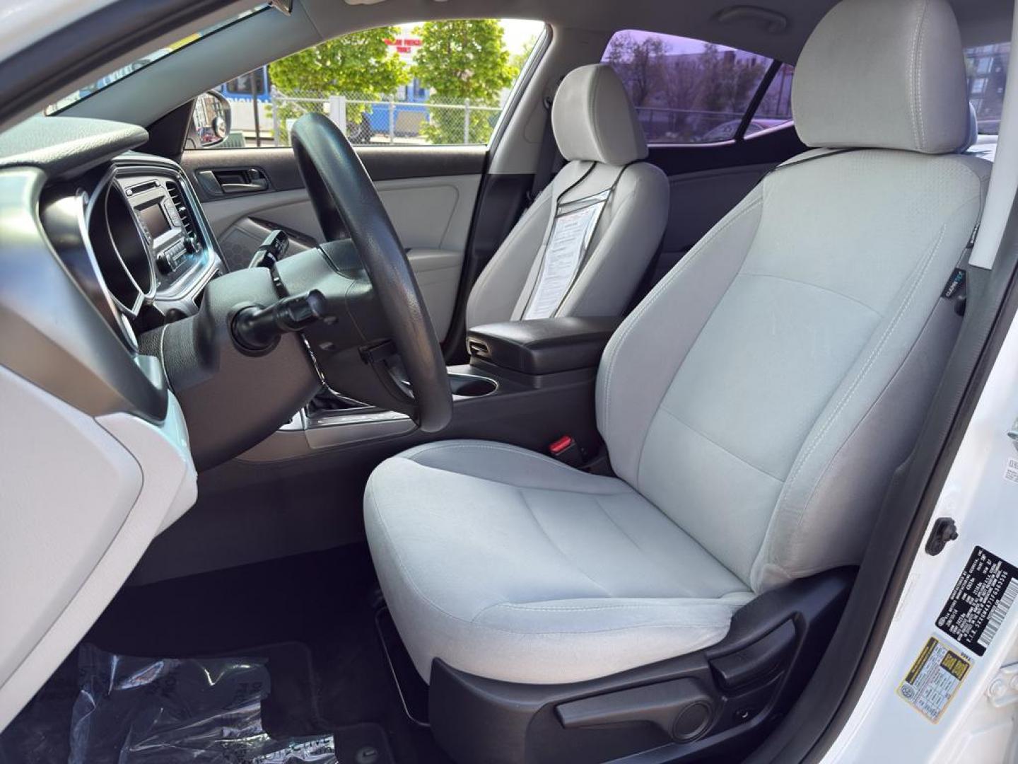 2015 WHITE Kia Optima LX (5XXGM4A71FG) with an 4 Cyl, 2.4L engine, Automatic transmission, located at 10890 W. Colfax Ave., Lakewood, CO, 80215, (303) 274-7692, 39.739914, -105.120132 - Photo#16