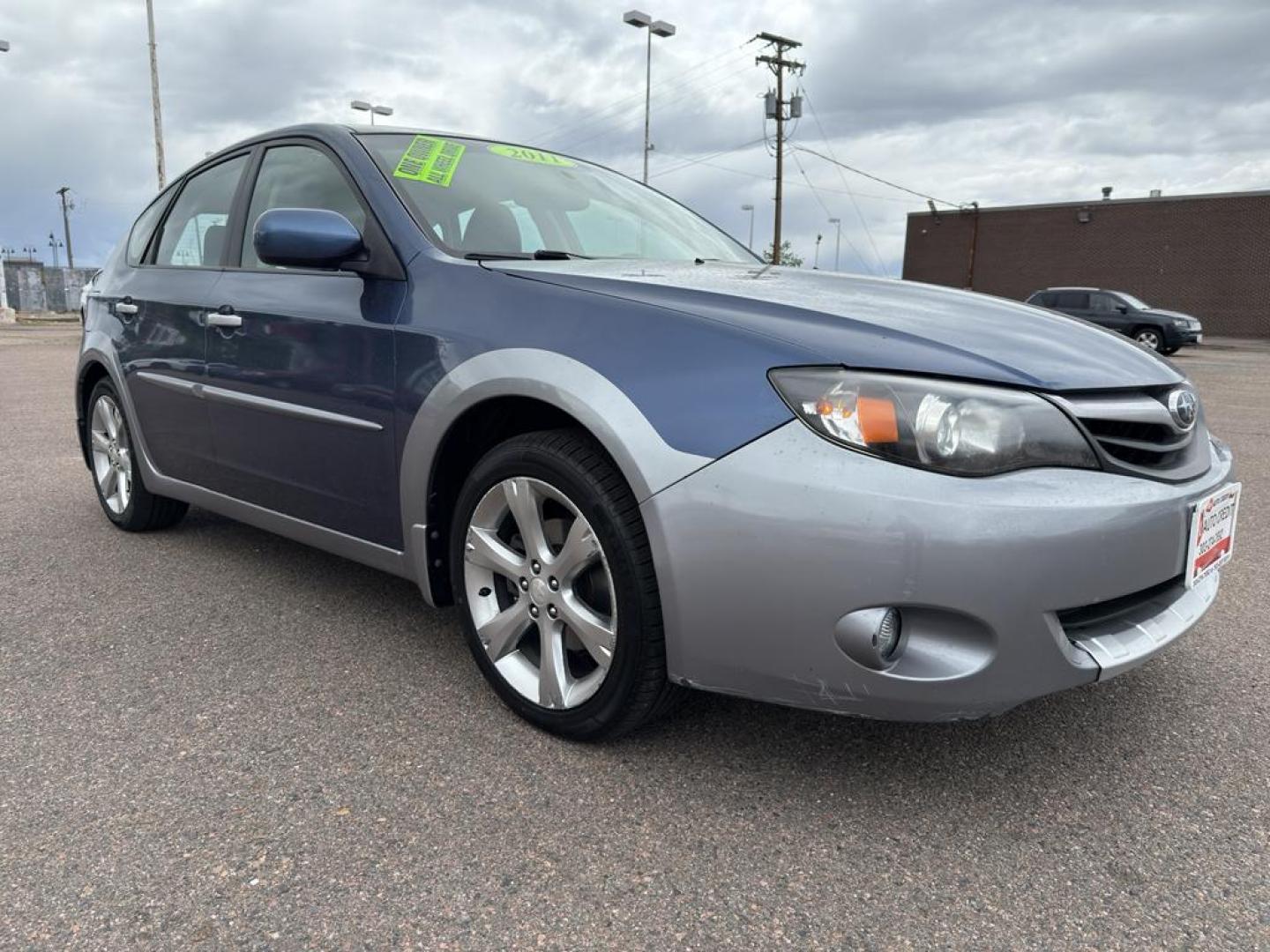 2011 BLUE Subaru Impreza Outback Sport (JF1GH6D6XBH) with an 4 Cyl, 2.5L engine, Automatic transmission, located at 10890 W. Colfax Ave., Lakewood, CO, 80215, (303) 274-7692, 39.739914, -105.120132 - Explore the exceptional versatility of the 2011 Subaru Impreza Outback Sport, an ideal choice for those seeking reliability and performance in a compact package. This well-maintained model features Subarus renowned All-Wheel Drive system, ensuring confident handling and stability in varied driving c - Photo#2