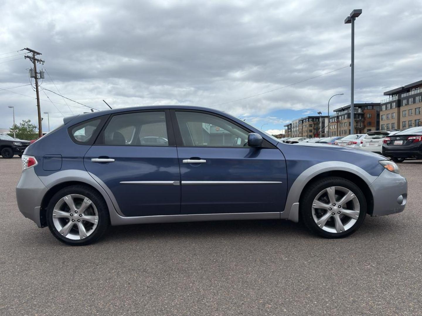 2011 BLUE Subaru Impreza Outback Sport (JF1GH6D6XBH) with an 4 Cyl, 2.5L engine, Automatic transmission, located at 10890 W. Colfax Ave., Lakewood, CO, 80215, (303) 274-7692, 39.739914, -105.120132 - Explore the exceptional versatility of the 2011 Subaru Impreza Outback Sport, an ideal choice for those seeking reliability and performance in a compact package. This well-maintained model features Subarus renowned All-Wheel Drive system, ensuring confident handling and stability in varied driving c - Photo#3