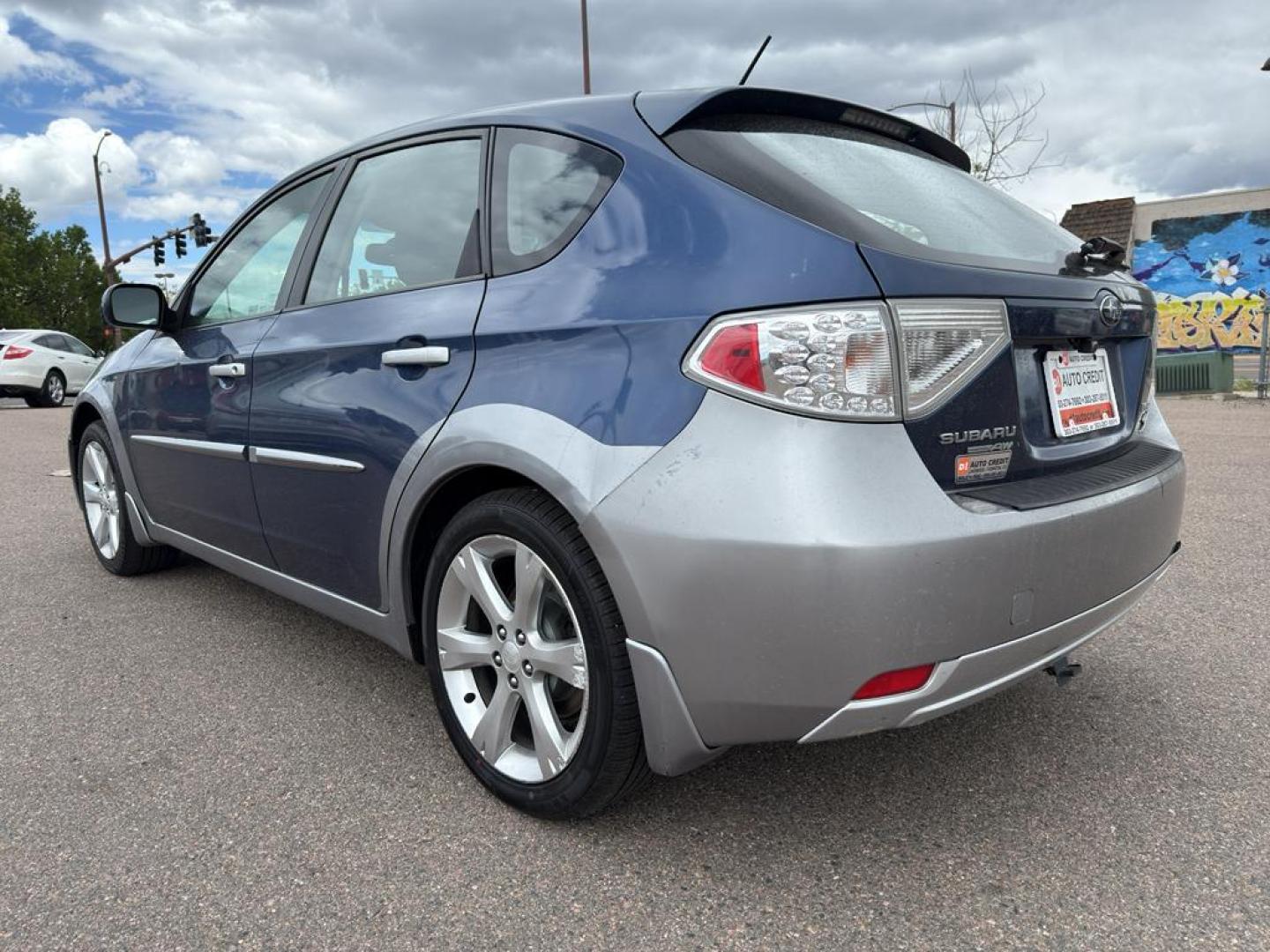 2011 BLUE Subaru Impreza Outback Sport (JF1GH6D6XBH) with an 4 Cyl, 2.5L engine, Automatic transmission, located at 10890 W. Colfax Ave., Lakewood, CO, 80215, (303) 274-7692, 39.739914, -105.120132 - Explore the exceptional versatility of the 2011 Subaru Impreza Outback Sport, an ideal choice for those seeking reliability and performance in a compact package. This well-maintained model features Subarus renowned All-Wheel Drive system, ensuring confident handling and stability in varied driving c - Photo#6