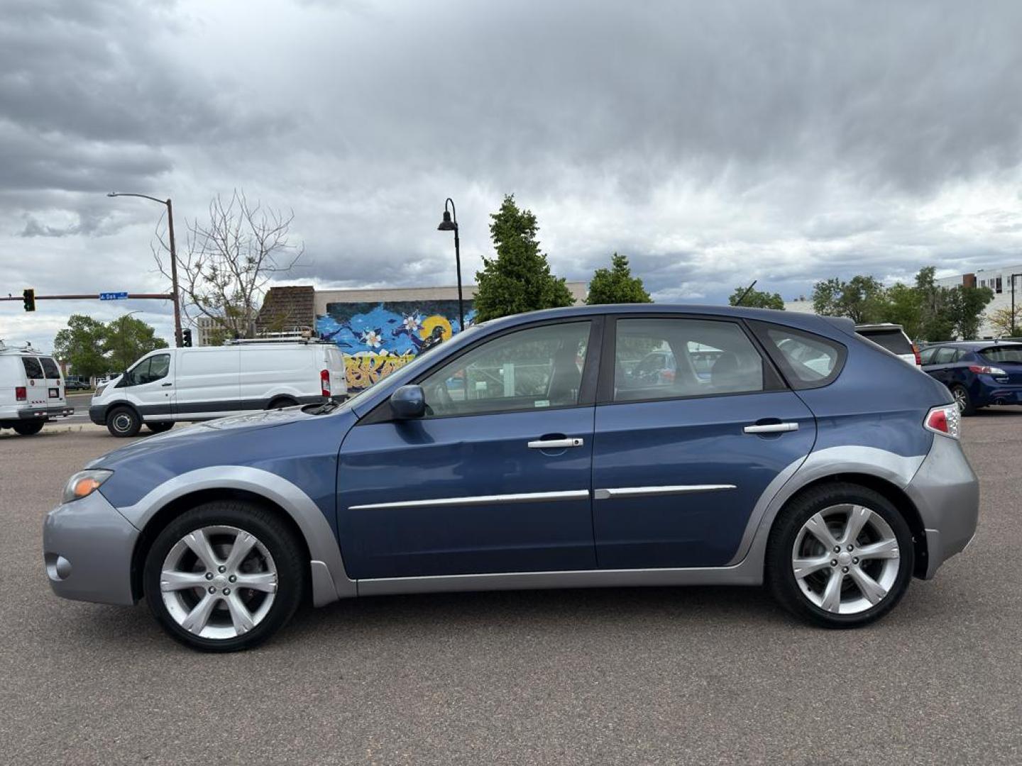 2011 BLUE Subaru Impreza Outback Sport (JF1GH6D6XBH) with an 4 Cyl, 2.5L engine, Automatic transmission, located at 10890 W. Colfax Ave., Lakewood, CO, 80215, (303) 274-7692, 39.739914, -105.120132 - Explore the exceptional versatility of the 2011 Subaru Impreza Outback Sport, an ideal choice for those seeking reliability and performance in a compact package. This well-maintained model features Subarus renowned All-Wheel Drive system, ensuring confident handling and stability in varied driving c - Photo#7
