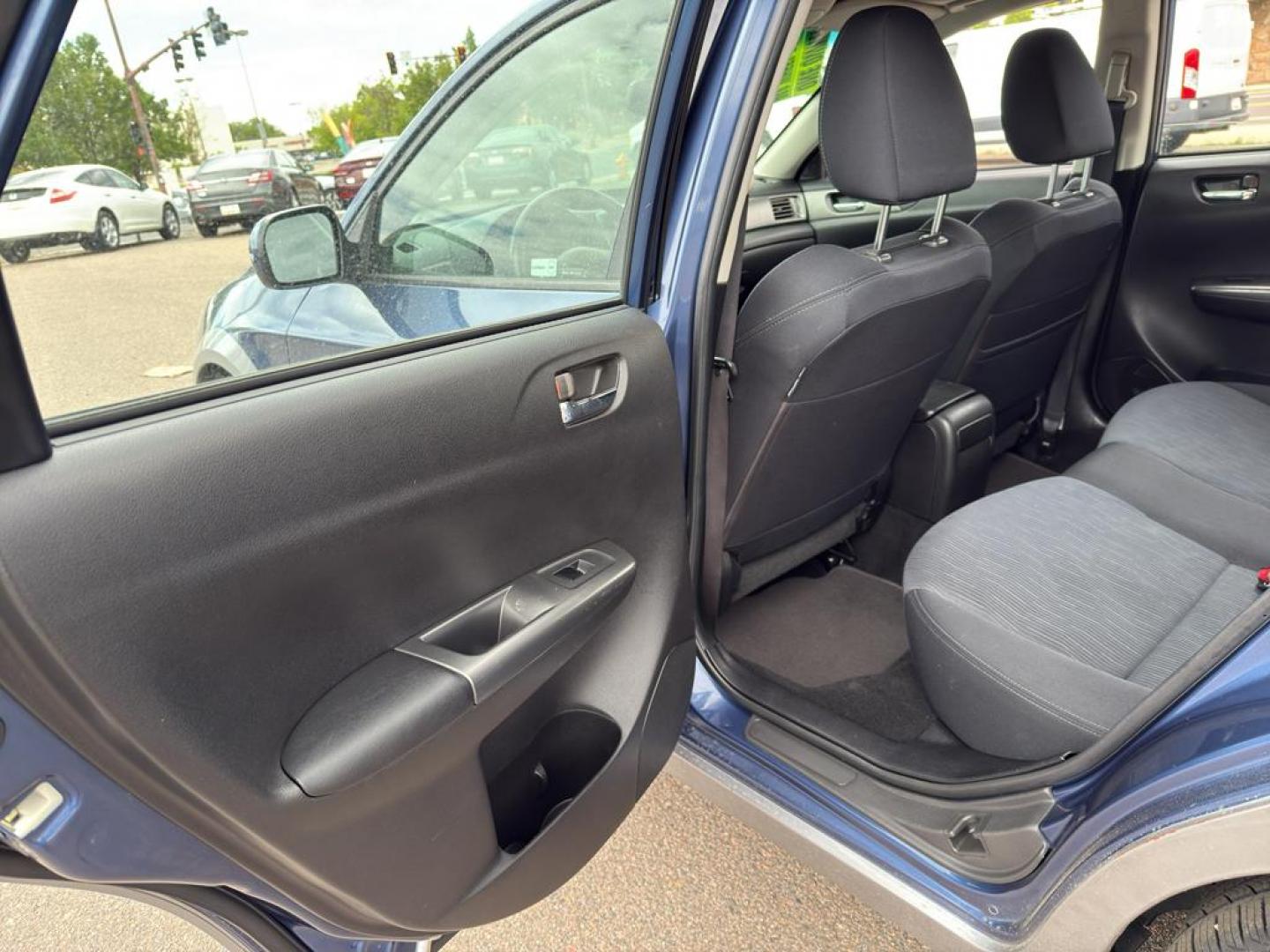 2011 BLUE Subaru Impreza Outback Sport (JF1GH6D6XBH) with an 4 Cyl, 2.5L engine, Automatic transmission, located at 10890 W. Colfax Ave., Lakewood, CO, 80215, (303) 274-7692, 39.739914, -105.120132 - Explore the exceptional versatility of the 2011 Subaru Impreza Outback Sport, an ideal choice for those seeking reliability and performance in a compact package. This well-maintained model features Subarus renowned All-Wheel Drive system, ensuring confident handling and stability in varied driving c - Photo#13