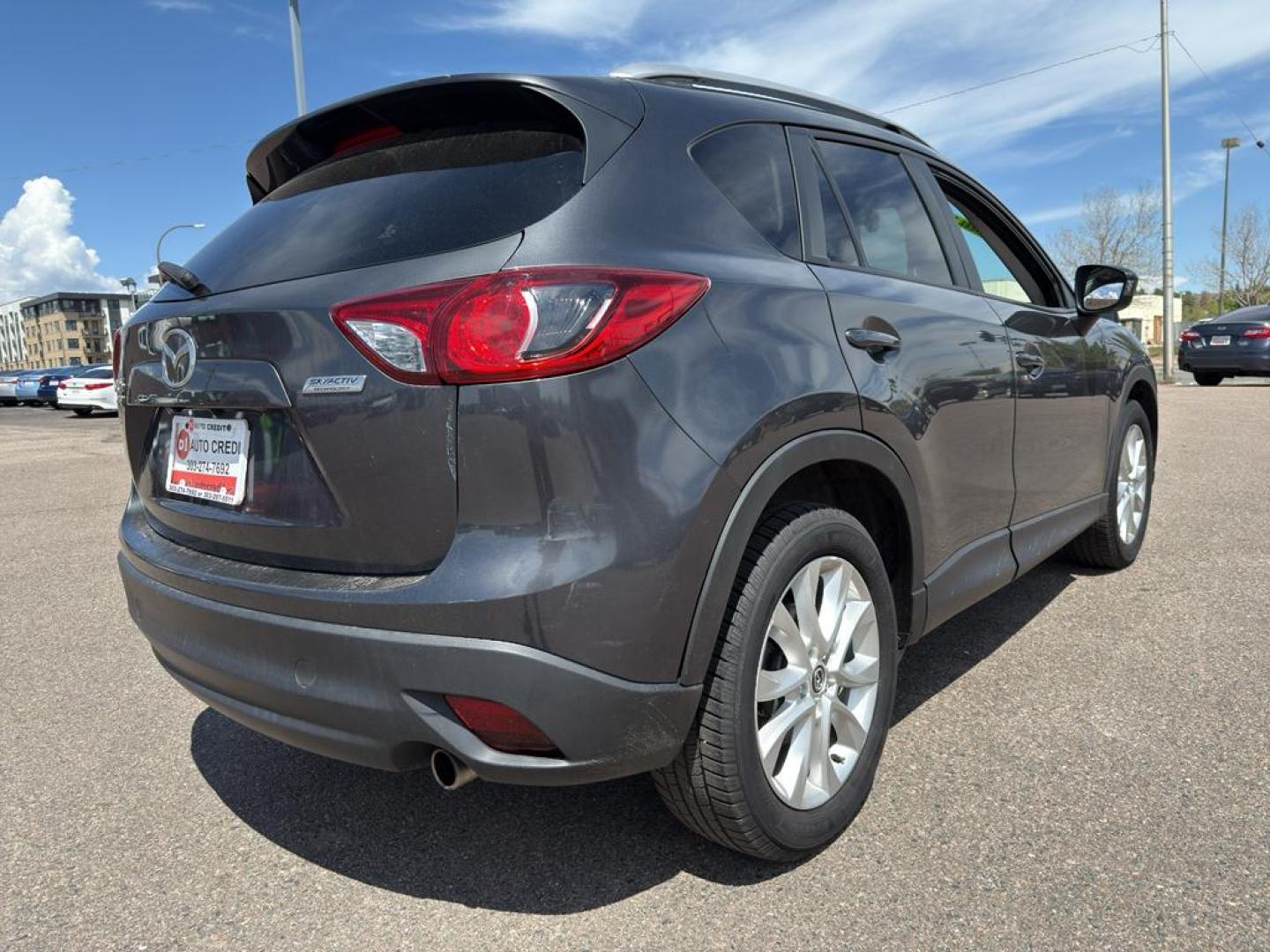 2014 GRAY Mazda CX-5 Grand Touring (JM3KE4DY4E0) with an 4 Cyl, 2.5L engine, Automatic transmission, located at 10890 W. Colfax Ave., Lakewood, CO, 80215, (303) 274-7692, 39.739914, -105.120132 - Photo#4