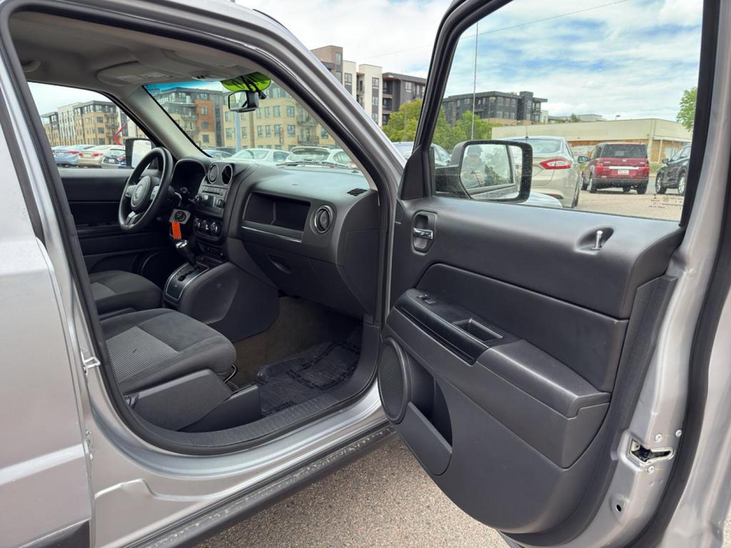 2016 SILVER Jeep Patriot Sport (1C4NJRBB0GD) with an 4 Cyl, 2.4L engine, Automatic transmission, located at 10890 W. Colfax Ave., Lakewood, CO, 80215, (303) 274-7692, 39.739914, -105.120132 - Discover the perfect blend of reliability and adventure with our 2016 Jeep Patriot Sport, now available for sale. This versatile SUV is equipped with a robust 4WD system, making it an ideal companion for both city drives and off-road adventures. Under the hood, youll find a fuel-efficient 4-cylinder - Photo#8