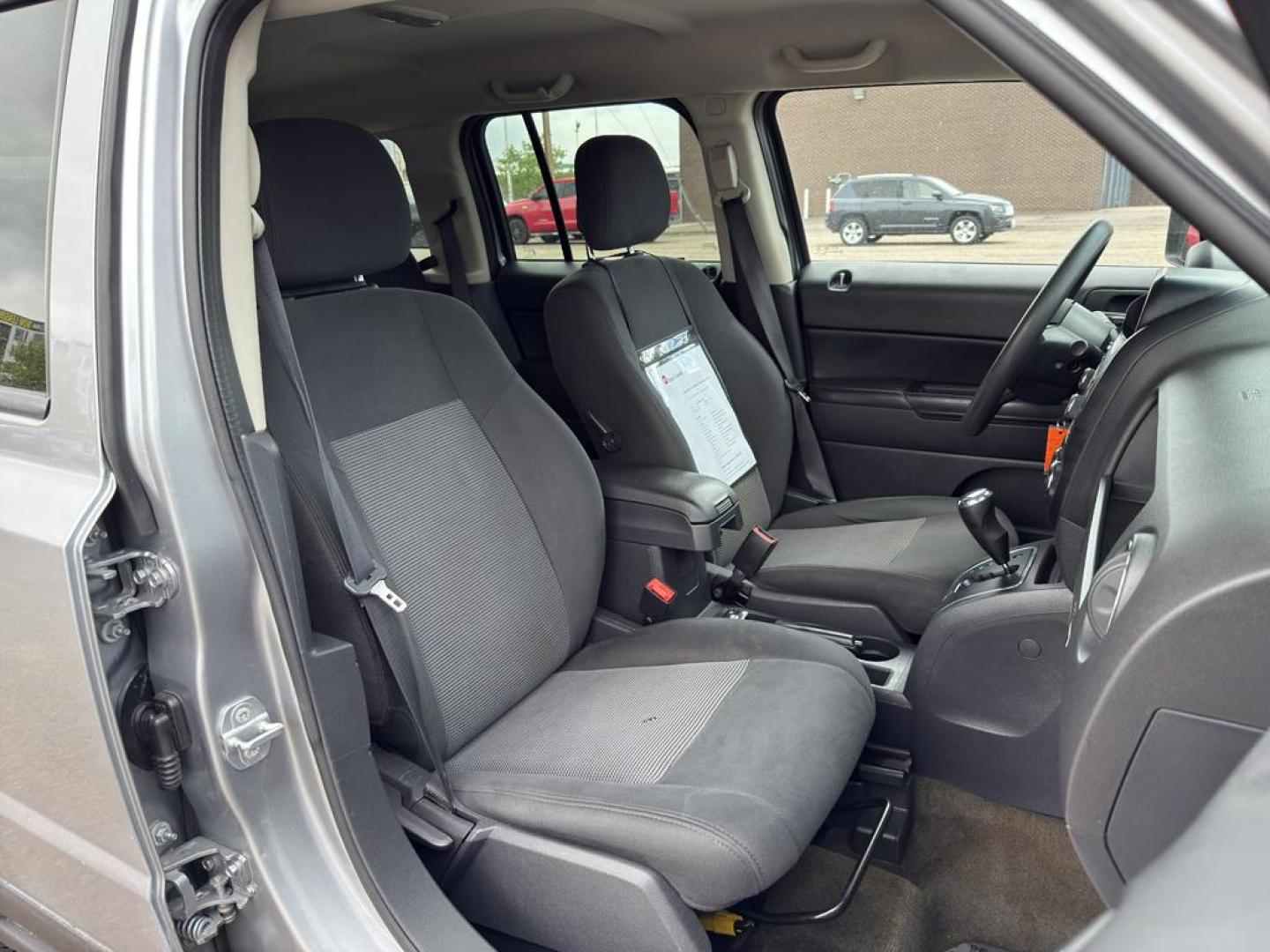 2016 SILVER Jeep Patriot Sport (1C4NJRBB0GD) with an 4 Cyl, 2.4L engine, Automatic transmission, located at 10890 W. Colfax Ave., Lakewood, CO, 80215, (303) 274-7692, 39.739914, -105.120132 - Discover the perfect blend of reliability and adventure with our 2016 Jeep Patriot Sport, now available for sale. This versatile SUV is equipped with a robust 4WD system, making it an ideal companion for both city drives and off-road adventures. Under the hood, youll find a fuel-efficient 4-cylinder - Photo#9