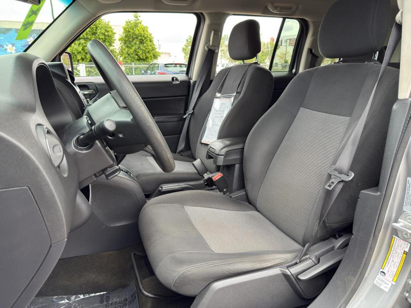 2016 SILVER Jeep Patriot Sport (1C4NJRBB0GD) with an 4 Cyl, 2.4L engine, Automatic transmission, located at 10890 W. Colfax Ave., Lakewood, CO, 80215, (303) 274-7692, 39.739914, -105.120132 - Discover the perfect blend of reliability and adventure with our 2016 Jeep Patriot Sport, now available for sale. This versatile SUV is equipped with a robust 4WD system, making it an ideal companion for both city drives and off-road adventures. Under the hood, youll find a fuel-efficient 4-cylinder - Photo#16