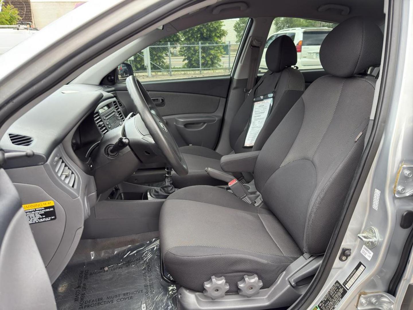 2008 SILVER Kia Rio BASE (KNADE123386) with an 4 Cyl, 1.6L engine, Manual transmission, located at 10890 W. Colfax Ave., Lakewood, CO, 80215, (303) 274-7692, 39.739914, -105.120132 - Discover the reliability and efficiency of this 2008 Kia Rio BASE, a perfect blend of practicality and performance. With its sleek design and compact build, this vehicle is ideal for city driving and easy maneuverability. Powered by a 4-cylinder, 1.6L engine, the Kia Rio offers a balanced mix of pow - Photo#15