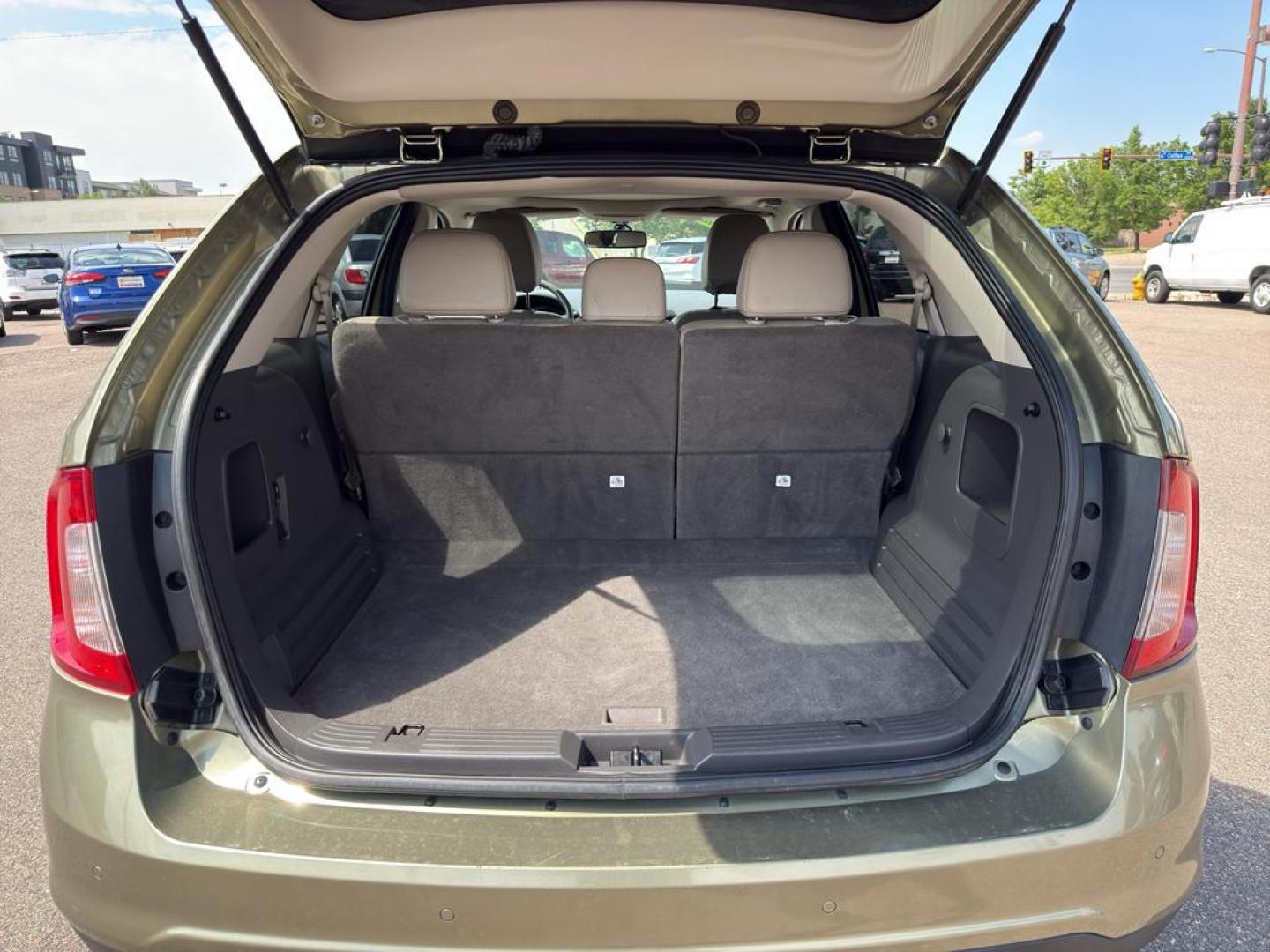 2013 GOLD Ford Edge SEL (2FMDK4JC0DB) with an V6, 3.5L engine, Automatic transmission, located at 10890 W. Colfax Ave., Lakewood, CO, 80215, (303) 274-7692, 39.739914, -105.120132 - Discover the perfect blend of performance and comfort with this 2013 Ford Edge SEL, featuring the confidence of All-Wheel Drive and powered by a robust 3.5L V6 engine. This exceptional vehicle offers a smooth and dynamic driving experience, making it an ideal choice for both city commutes and weeken - Photo#12