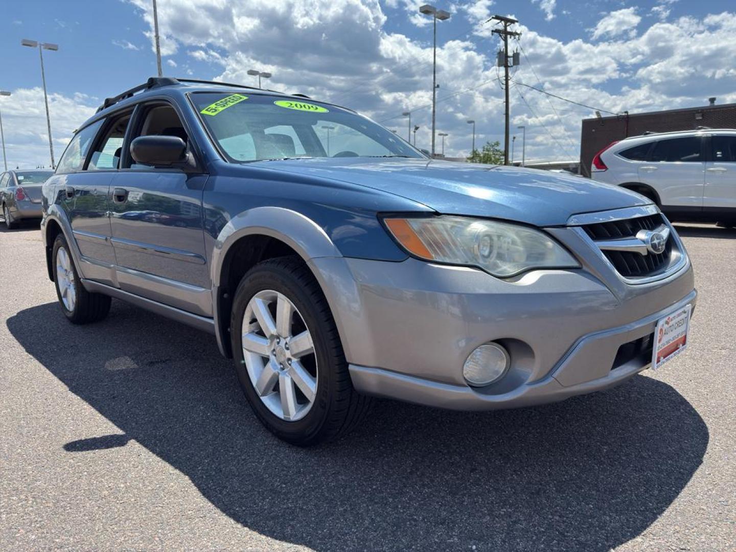 2009 BLUE Subaru Outback i (4S4BP61C896) with an 4 Cyl, 2.5L engine, Manual transmission, located at 10890 W. Colfax Ave., Lakewood, CO, 80215, (303) 274-7692, 39.739914, -105.120132 - For those seeking reliability and performance, look no further than this 2009 Subaru Outback i with All-Wheel Drive. This versatile vehicle is perfect for tackling diverse road conditions, making it an ideal choice for both city driving and outdoor adventures. Equipped with a fuel-efficient 4-cylind - Photo#2