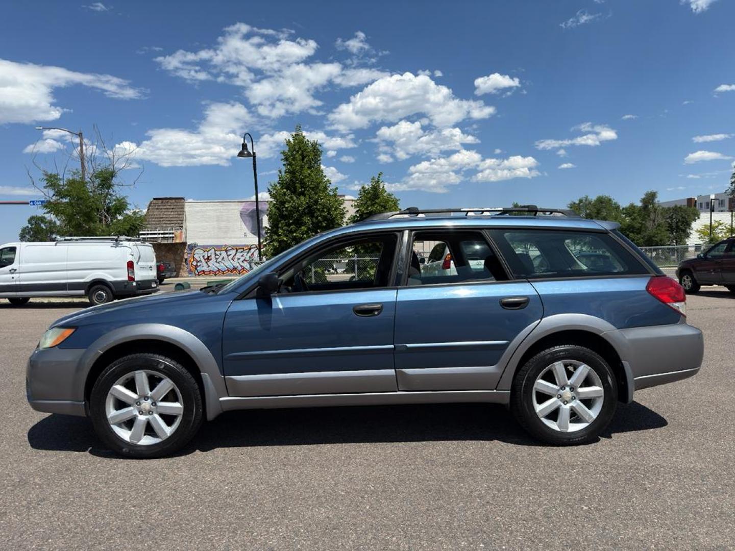 2009 BLUE Subaru Outback i (4S4BP61C896) with an 4 Cyl, 2.5L engine, Manual transmission, located at 10890 W. Colfax Ave., Lakewood, CO, 80215, (303) 274-7692, 39.739914, -105.120132 - For those seeking reliability and performance, look no further than this 2009 Subaru Outback i with All-Wheel Drive. This versatile vehicle is perfect for tackling diverse road conditions, making it an ideal choice for both city driving and outdoor adventures. Equipped with a fuel-efficient 4-cylind - Photo#7
