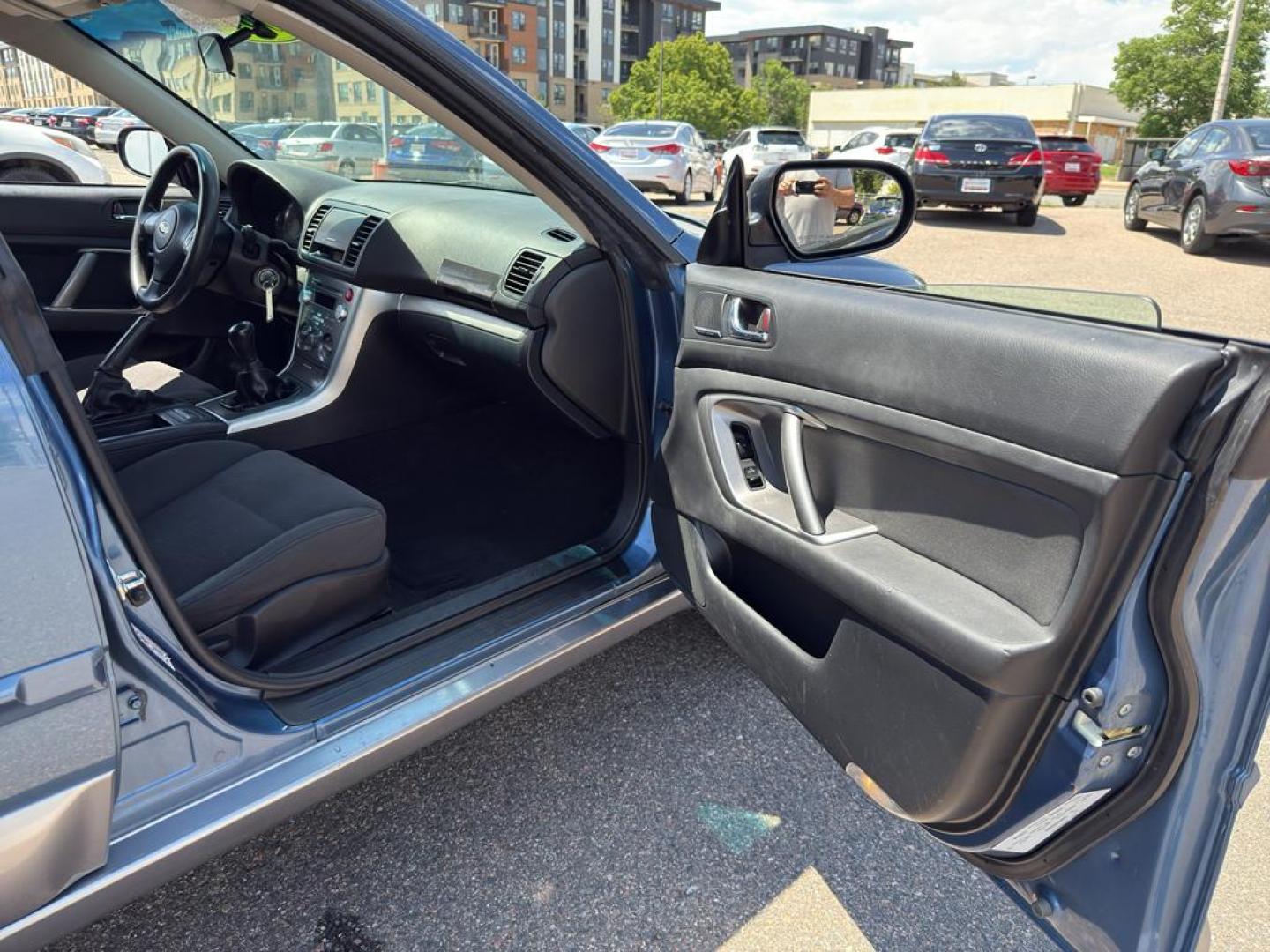 2009 BLUE Subaru Outback i (4S4BP61C896) with an 4 Cyl, 2.5L engine, Manual transmission, located at 10890 W. Colfax Ave., Lakewood, CO, 80215, (303) 274-7692, 39.739914, -105.120132 - For those seeking reliability and performance, look no further than this 2009 Subaru Outback i with All-Wheel Drive. This versatile vehicle is perfect for tackling diverse road conditions, making it an ideal choice for both city driving and outdoor adventures. Equipped with a fuel-efficient 4-cylind - Photo#12