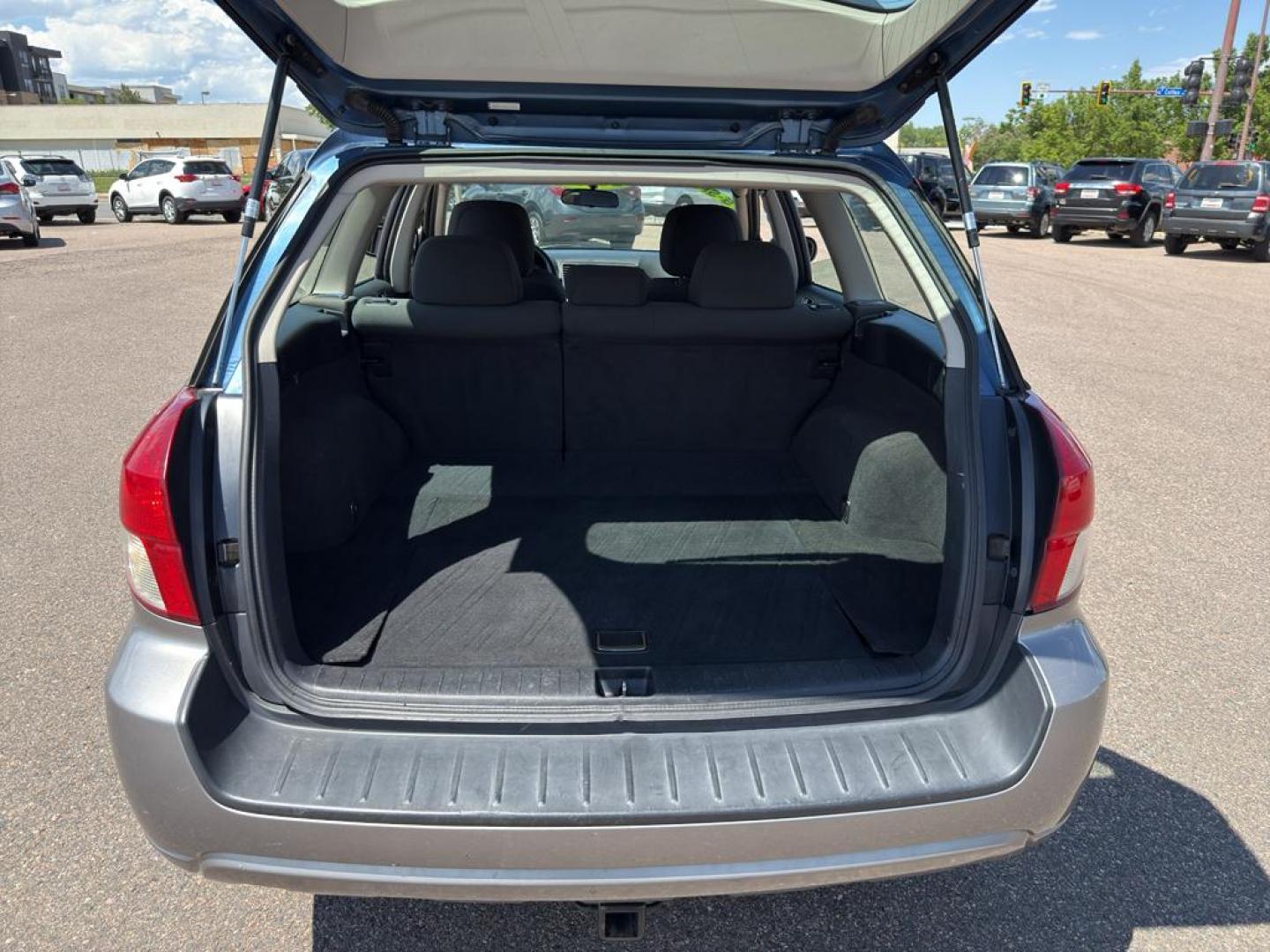 2009 BLUE Subaru Outback i (4S4BP61C896) with an 4 Cyl, 2.5L engine, Manual transmission, located at 10890 W. Colfax Ave., Lakewood, CO, 80215, (303) 274-7692, 39.739914, -105.120132 - For those seeking reliability and performance, look no further than this 2009 Subaru Outback i with All-Wheel Drive. This versatile vehicle is perfect for tackling diverse road conditions, making it an ideal choice for both city driving and outdoor adventures. Equipped with a fuel-efficient 4-cylind - Photo#16