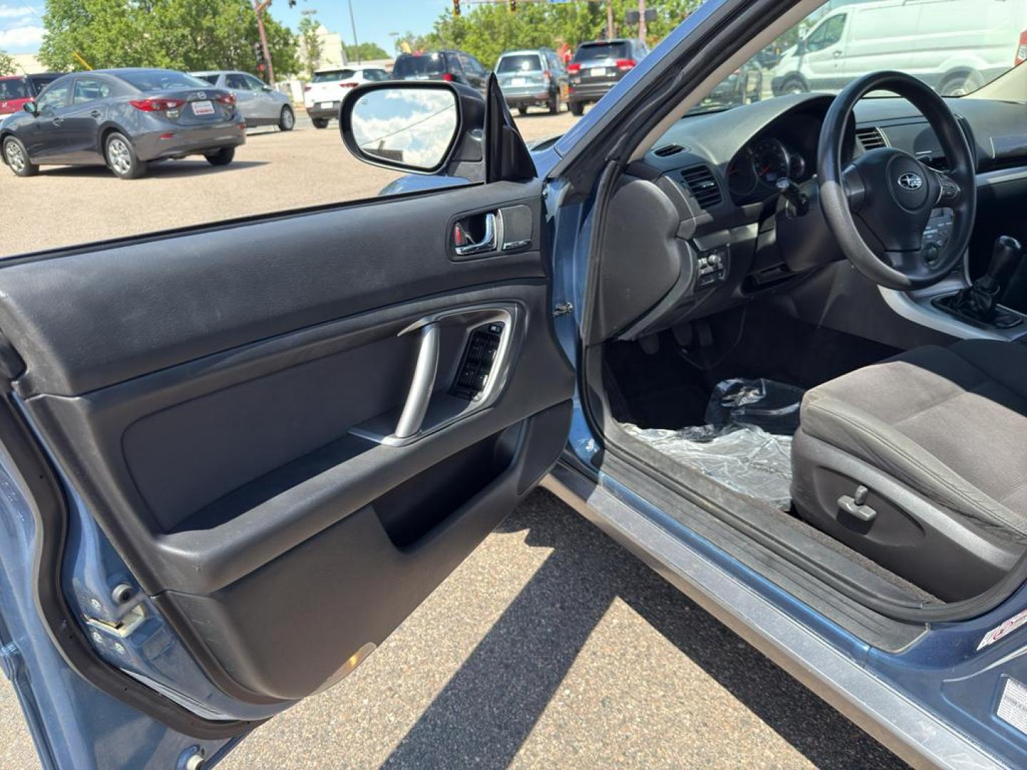 2009 BLUE Subaru Outback i (4S4BP61C896) with an 4 Cyl, 2.5L engine, Manual transmission, located at 10890 W. Colfax Ave., Lakewood, CO, 80215, (303) 274-7692, 39.739914, -105.120132 - For those seeking reliability and performance, look no further than this 2009 Subaru Outback i with All-Wheel Drive. This versatile vehicle is perfect for tackling diverse road conditions, making it an ideal choice for both city driving and outdoor adventures. Equipped with a fuel-efficient 4-cylind - Photo#19