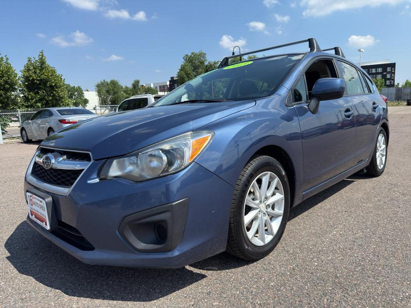 2013 BLUE Subaru Impreza Premium AWP (JF1GPAC66D2) with an 4 Cyl, 2.0L engine, Automatic transmission, located at 10890 W. Colfax Ave., Lakewood, CO, 80215, (303) 274-7692, 39.739914, -105.120132 - Photo#0