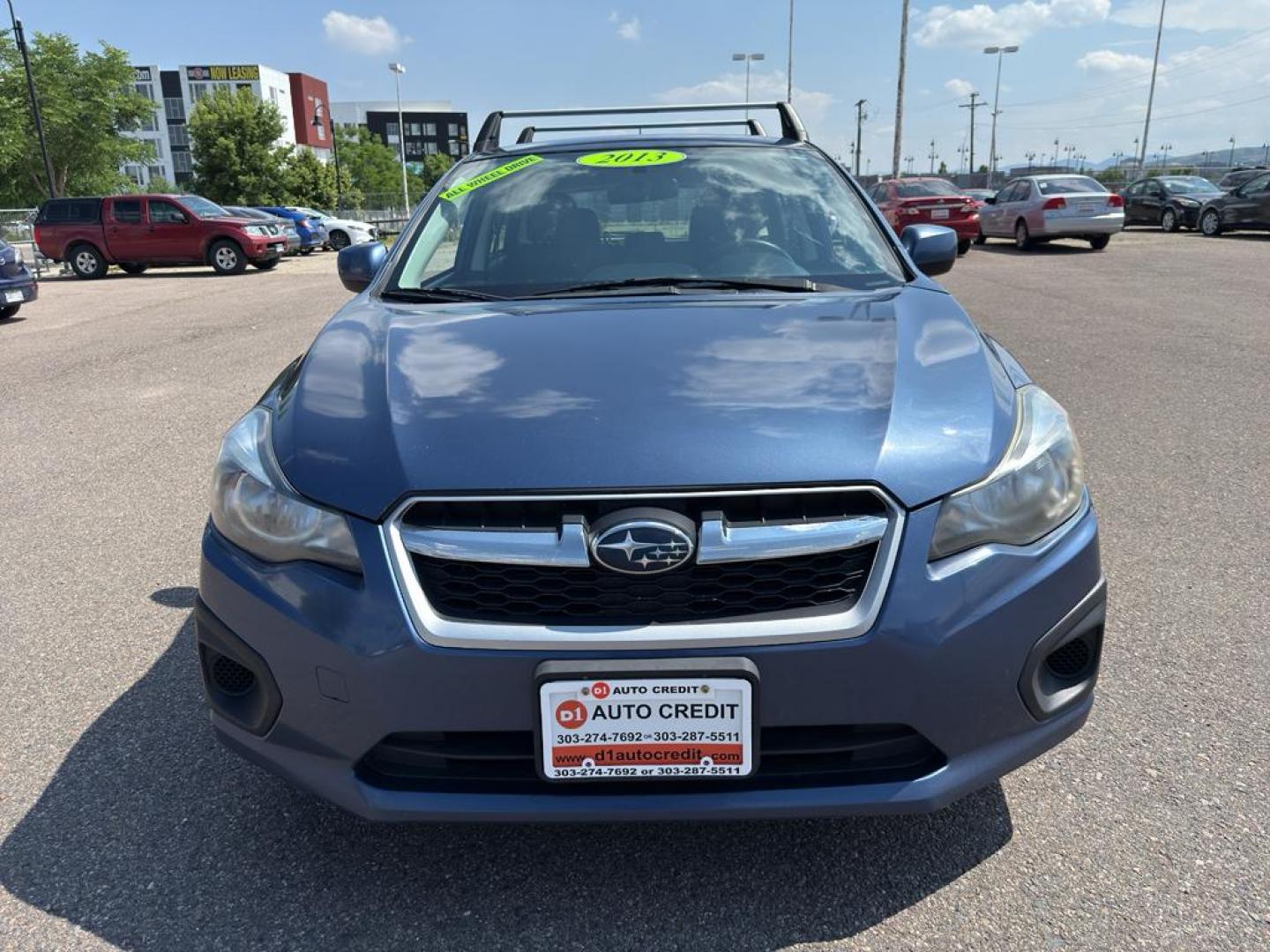 2013 BLUE Subaru Impreza Premium AWP (JF1GPAC66D2) with an 4 Cyl, 2.0L engine, Automatic transmission, located at 10890 W. Colfax Ave., Lakewood, CO, 80215, (303) 274-7692, 39.739914, -105.120132 - Photo#1