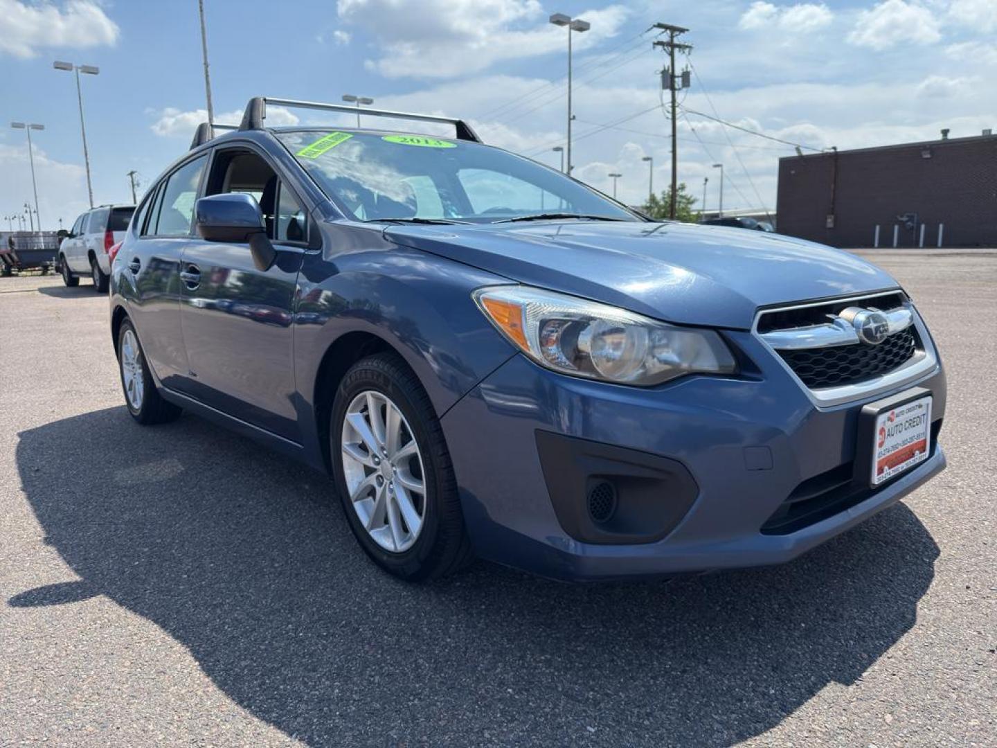 2013 BLUE Subaru Impreza Premium AWP (JF1GPAC66D2) with an 4 Cyl, 2.0L engine, Automatic transmission, located at 10890 W. Colfax Ave., Lakewood, CO, 80215, (303) 274-7692, 39.739914, -105.120132 - Photo#2