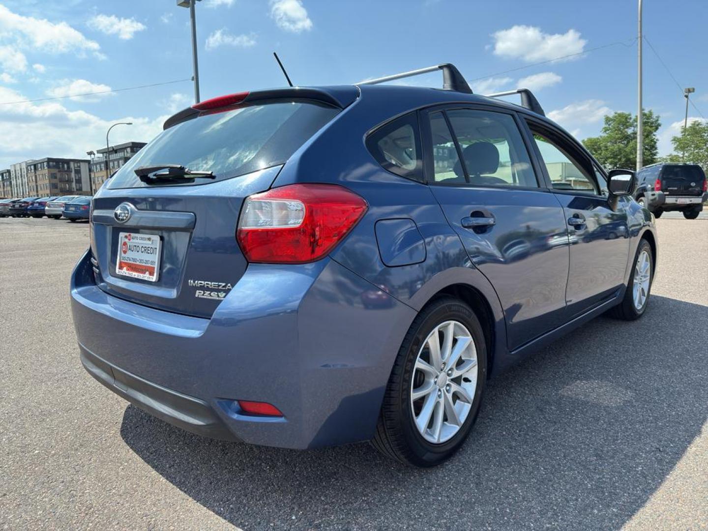 2013 BLUE Subaru Impreza Premium AWP (JF1GPAC66D2) with an 4 Cyl, 2.0L engine, Automatic transmission, located at 10890 W. Colfax Ave., Lakewood, CO, 80215, (303) 274-7692, 39.739914, -105.120132 - Photo#4