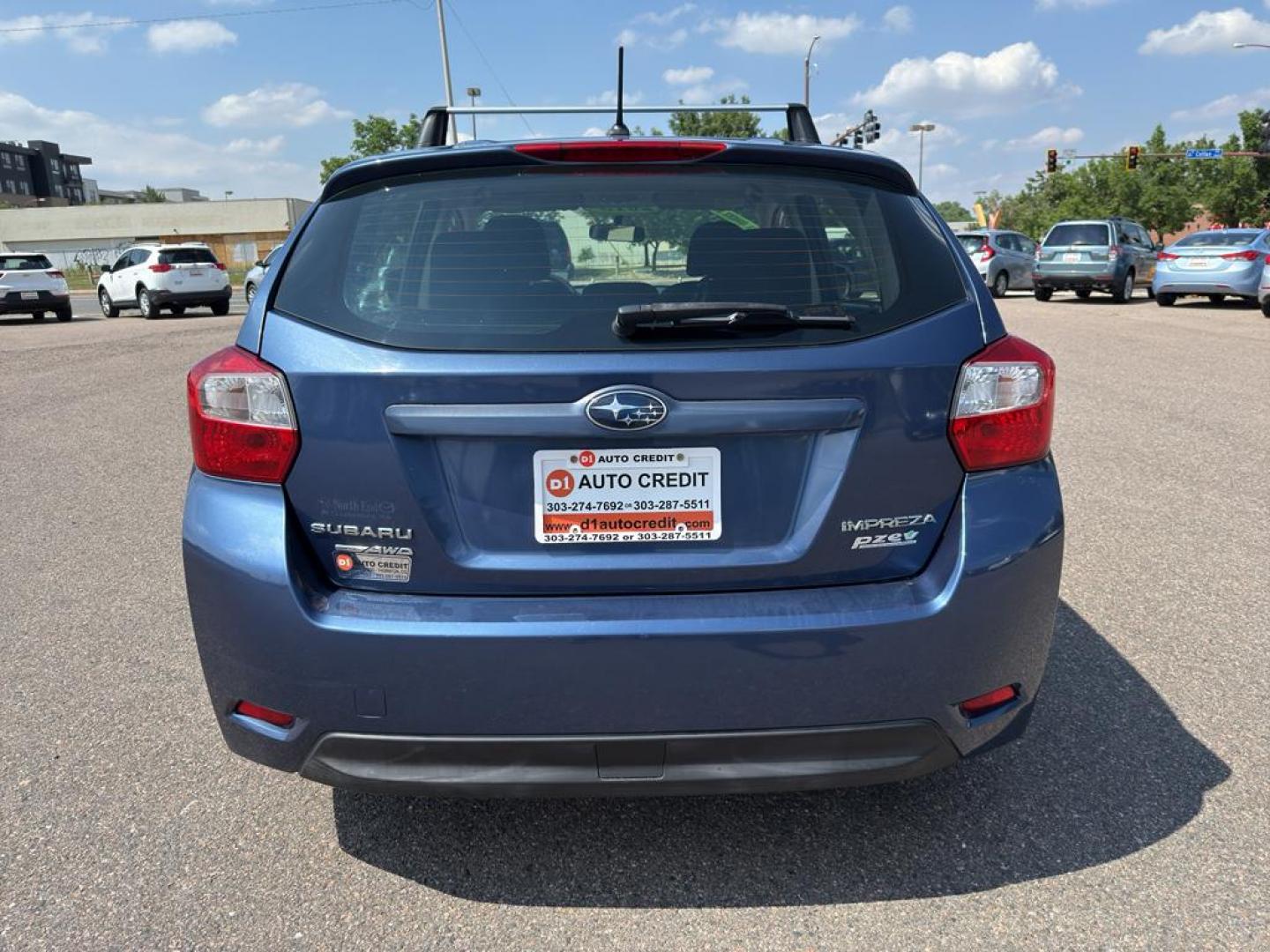 2013 BLUE Subaru Impreza Premium AWP (JF1GPAC66D2) with an 4 Cyl, 2.0L engine, Automatic transmission, located at 10890 W. Colfax Ave., Lakewood, CO, 80215, (303) 274-7692, 39.739914, -105.120132 - Photo#5