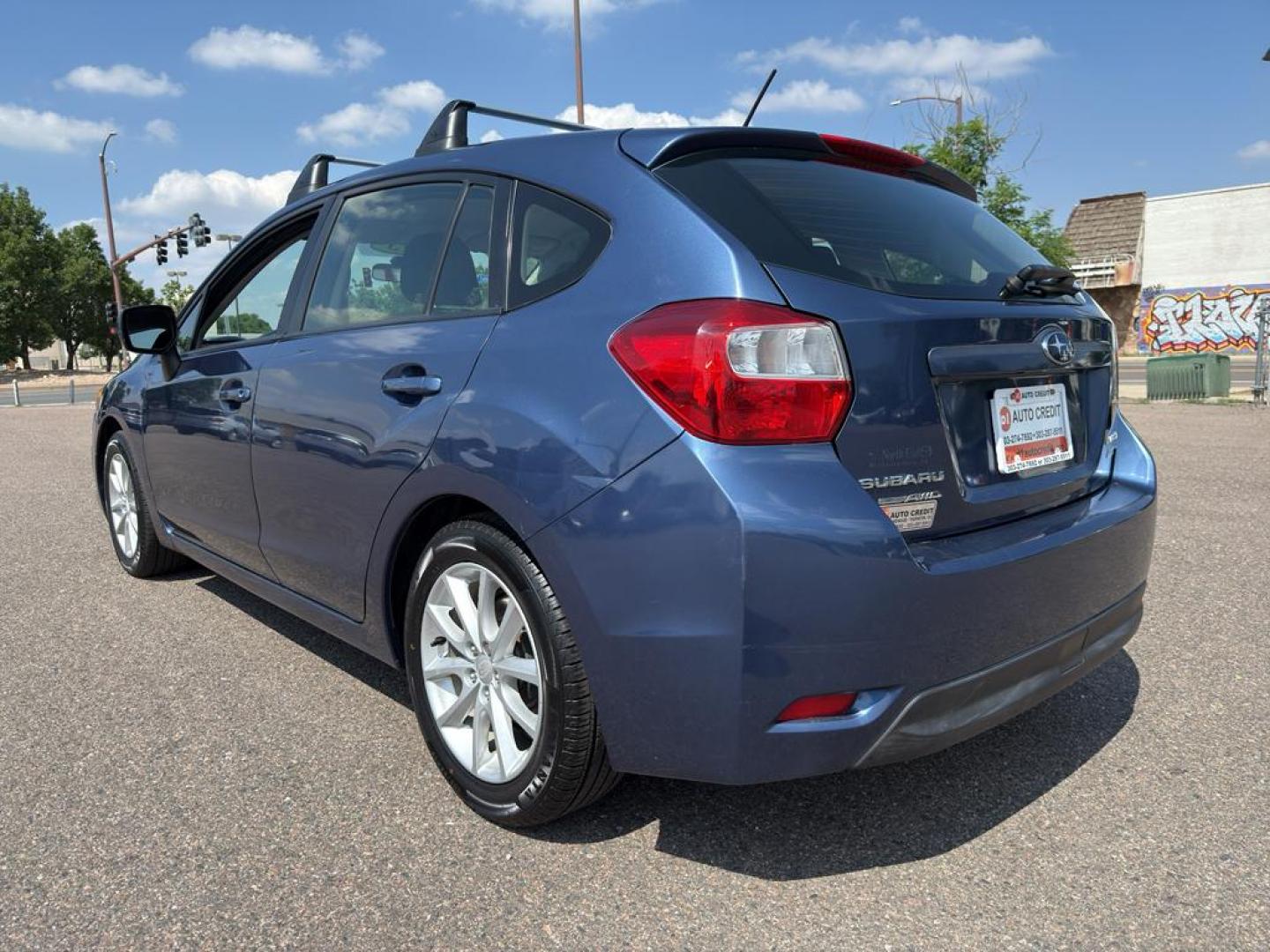 2013 BLUE Subaru Impreza Premium AWP (JF1GPAC66D2) with an 4 Cyl, 2.0L engine, Automatic transmission, located at 10890 W. Colfax Ave., Lakewood, CO, 80215, (303) 274-7692, 39.739914, -105.120132 - Photo#6