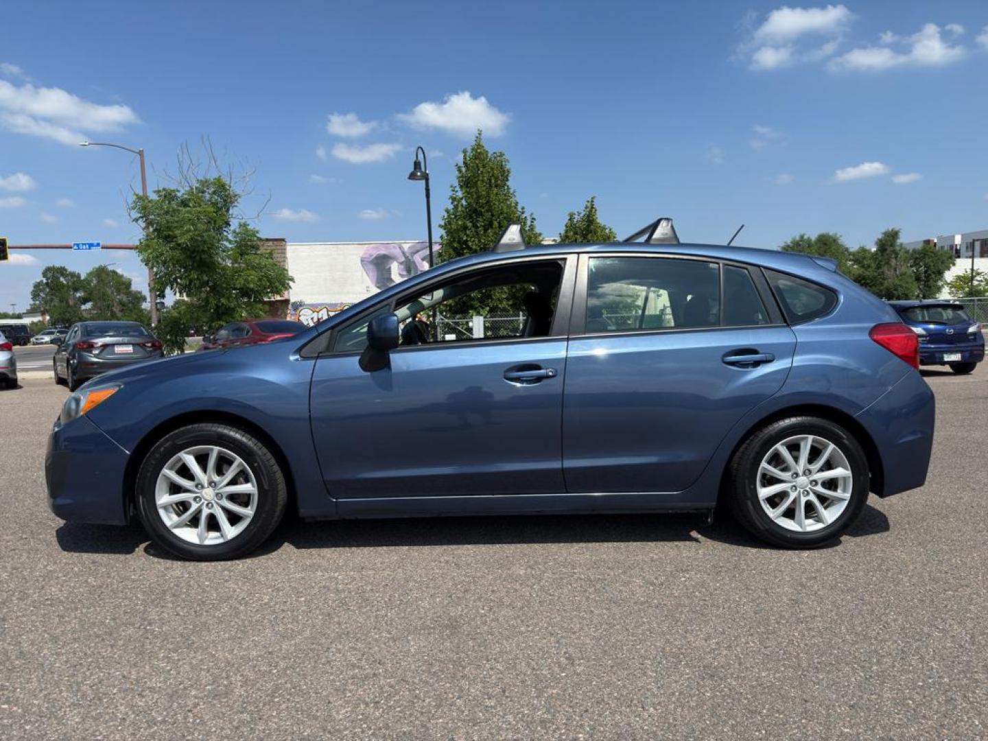 2013 BLUE Subaru Impreza Premium AWP (JF1GPAC66D2) with an 4 Cyl, 2.0L engine, Automatic transmission, located at 10890 W. Colfax Ave., Lakewood, CO, 80215, (303) 274-7692, 39.739914, -105.120132 - Photo#7